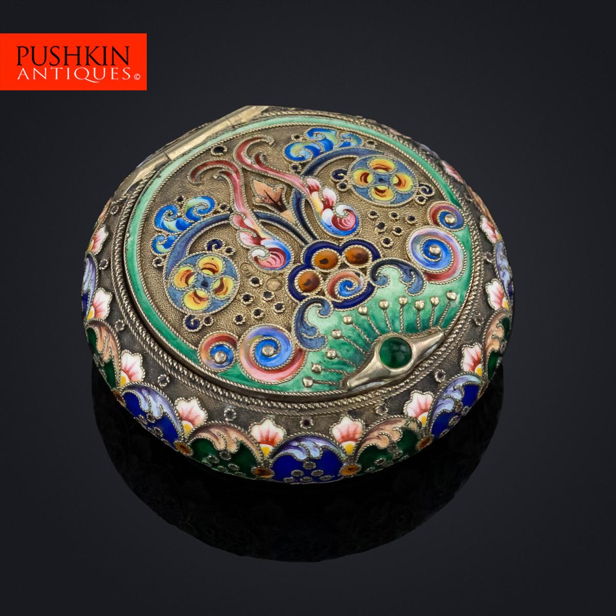 Antique early 20th century Imperial Russian solid silver and hand painted enamel, cushion shaped pill box, all side decorated with traditional Russian stylised flowers, foliage designs in polychrome cloisonne' enamel, the lid set with a gold and