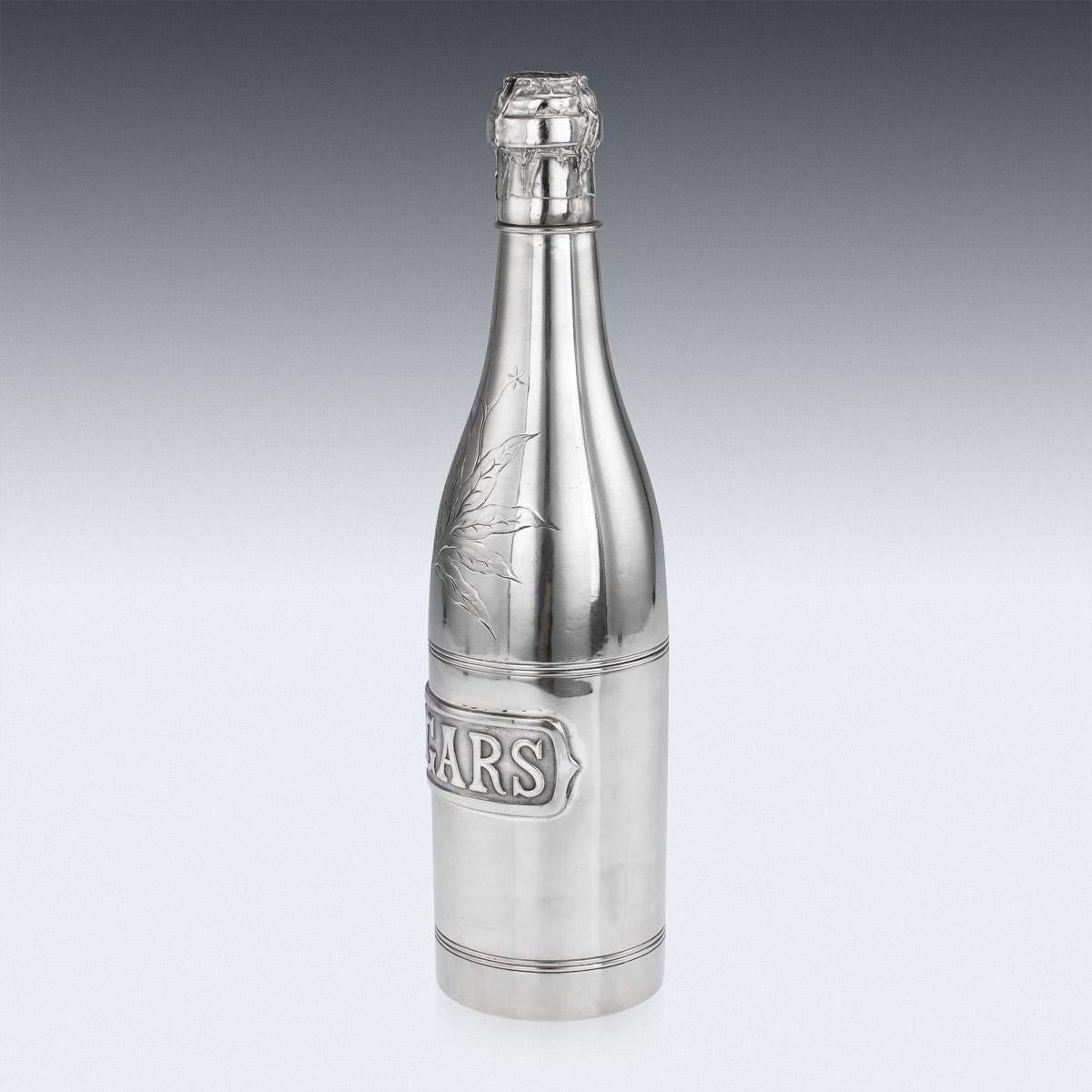 Antique early-20th century novelty silver plated champagne bottle shaped cigar holder, decorated with a tobacco leaf and a cigars sign, the bottle is made up of various screwed on compartments for cigars, tobacco and matches. Stamped on the base by