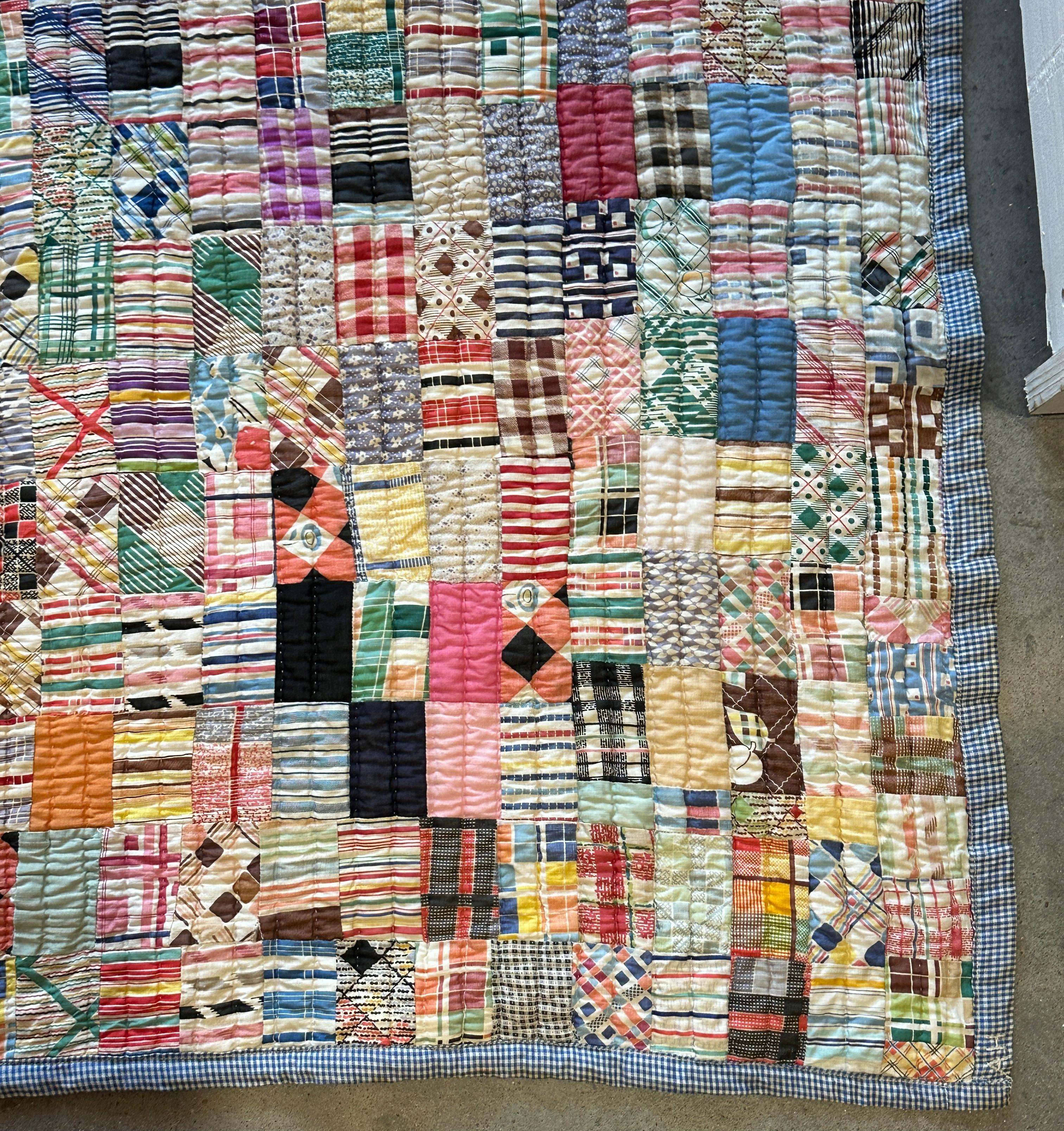 This fun and colorful mini pieced patchwork made from dress prints is in very good condition.It seems like it has never been laundered or used.