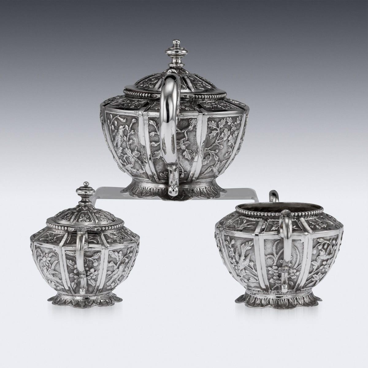 Antique early 20th century South Asian (Cambodian or Malaysian) solid silver tea set, comprising of teapot, sugar bowl and cream jug. Stunning three-piece tea set decorated with stylized floral decoration in rectangular reserves, bead boarders and
