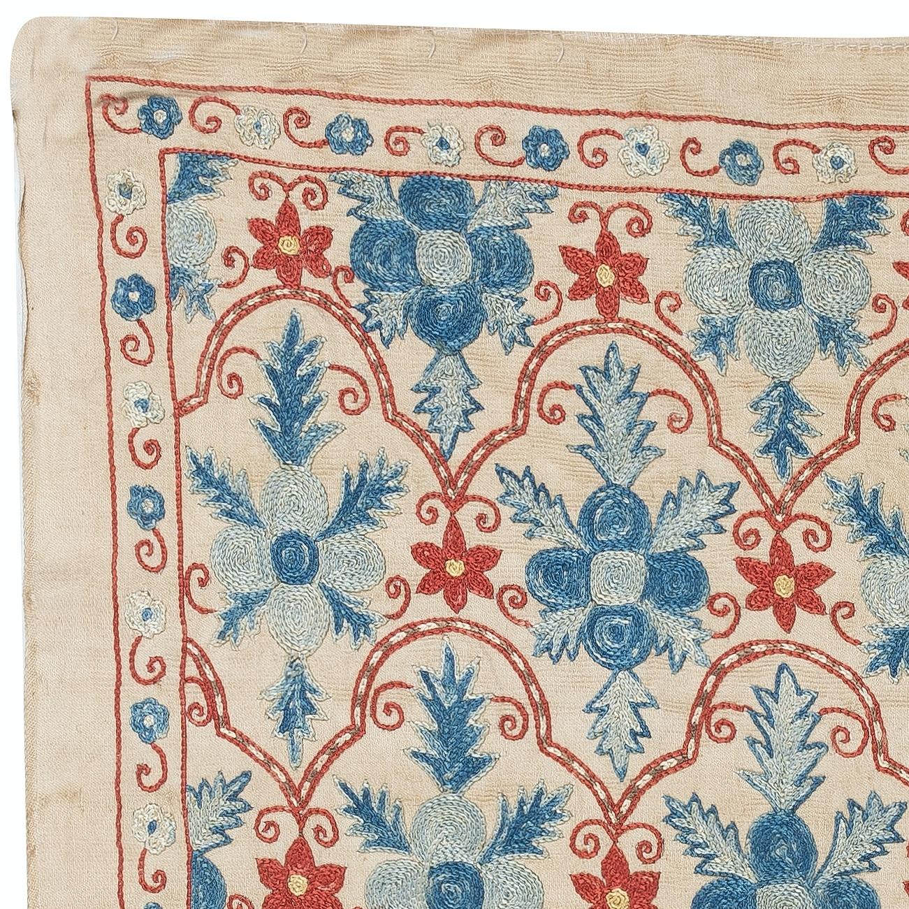 Celebrate the rich heritage of Asian craftsmanship with this exquisite 100% silk Suzani textile, meticulously hand-embroidered by skilled artisans. A true work of art, this piece embodies centuries of tradition, featuring intricate floral and