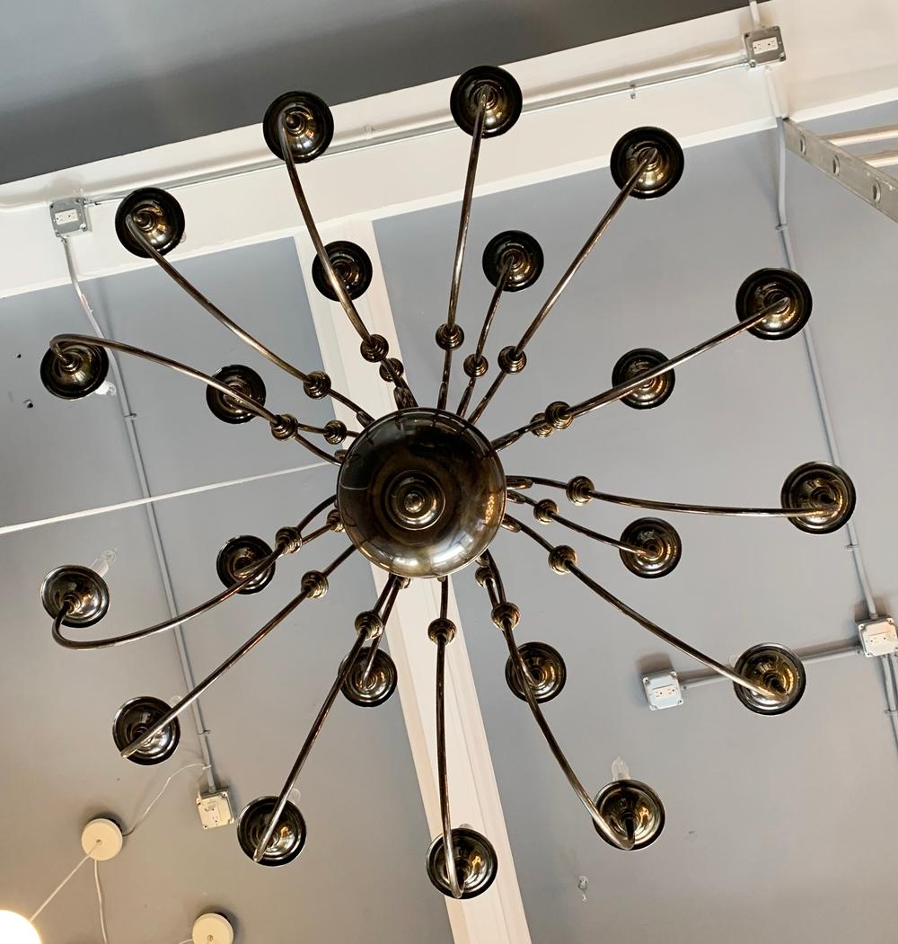 Beautiful chandelier with 21 arms made in solid brass, designed and manufactured in the USA by Feldman Lighting in the early 1980s.

The chandelier was installed at a church since it was ordered in the early 1980s and removed just a couple months