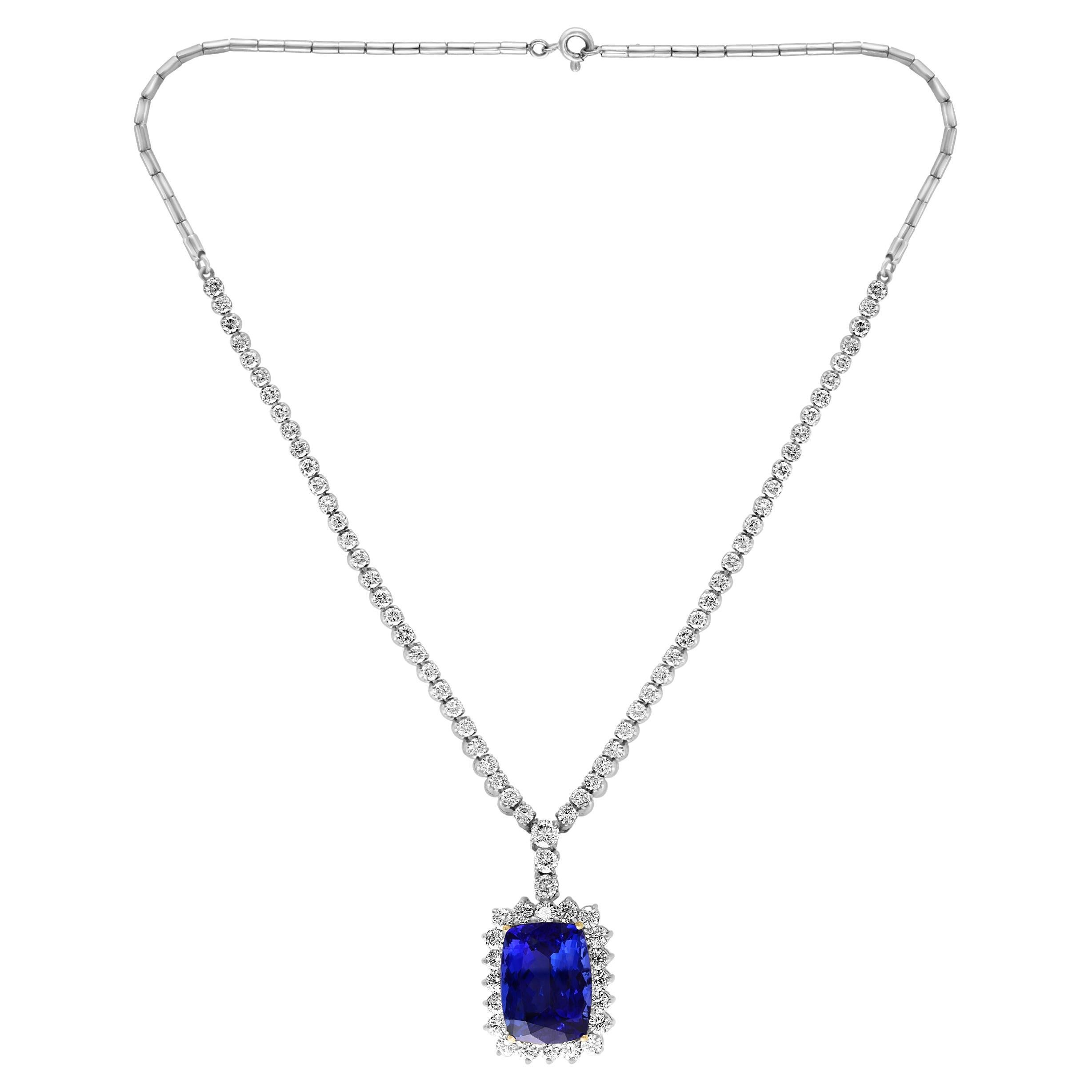 This extraordinary, 21 carat tanzanite is truly an extraordinary gemstone. There are  total  of approximately 9.5 carats of shimmering white diamonds, this brilliant cushion-cut gem exhibits the rich Violetish-blue color for which these stones are