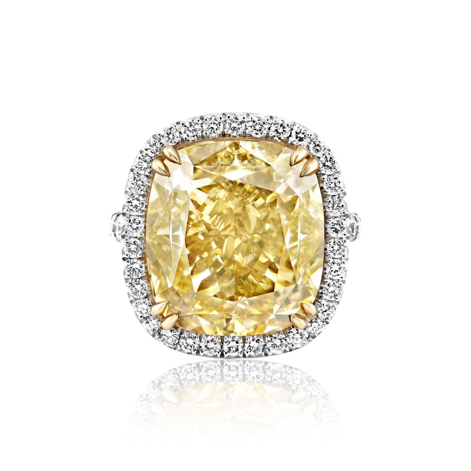 GIA Certified

Center Diamond:

Carat Weight: 20.03 Carats
Color : Fancy Brownish Greenish Yellow
Clarity: SI1
Style: Cushion Cut

Ring:
Settings: 4 Double Claw Prong, Halo
Metal: Platinum & 18 Karat Yellow Gold
Style: Round Brilliant Cut
Carat