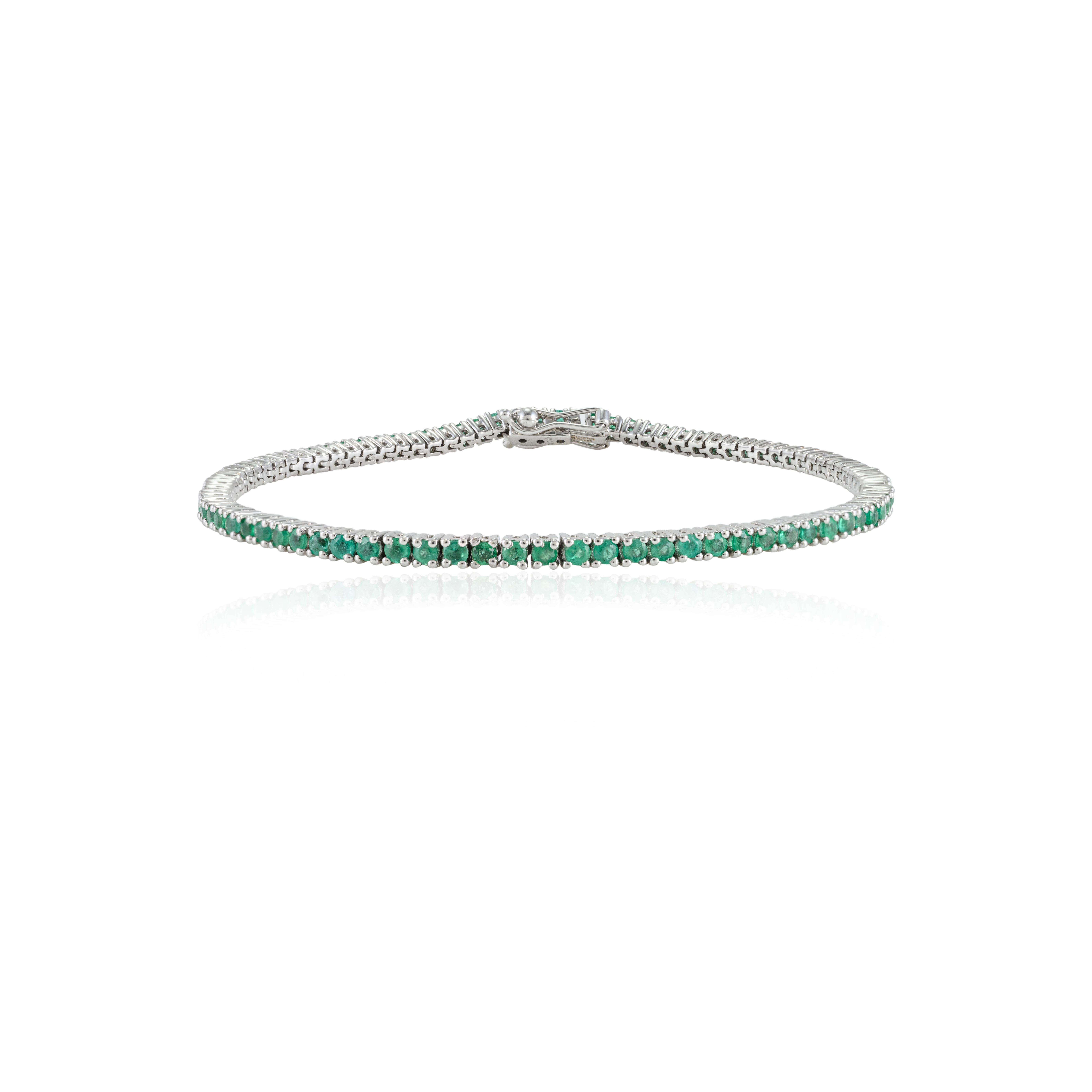 Round Cut 2.1 Carat Dainty Emerald May Birthstone Sleek Tennis Bracelet in 18k White Gold For Sale