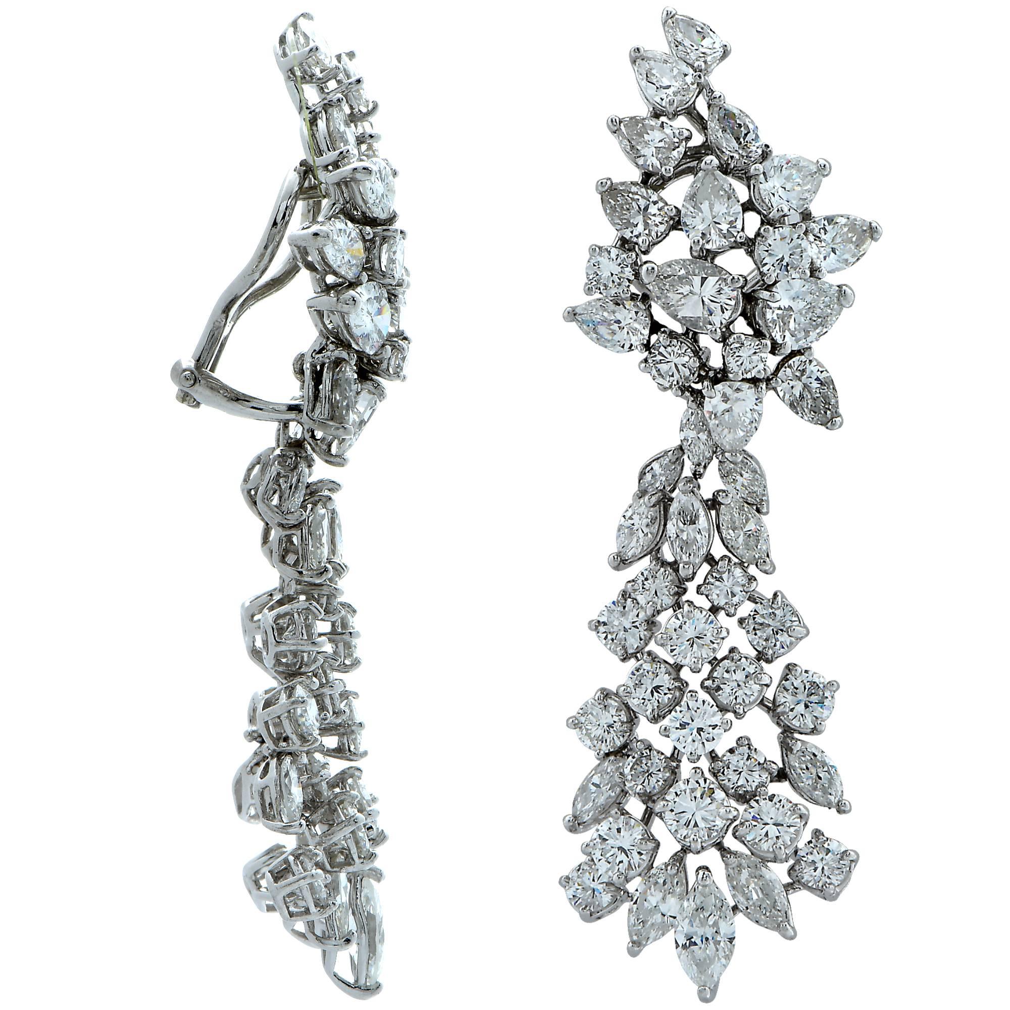 Spectacular dangle diamond earrings crafted in platinum, featuring mixed cut diamonds weighing approximately 21 carats total, F-H color and VS-SI clarity. Diamond drops dazzle with movement in a stunning display of brilliance and fire as they