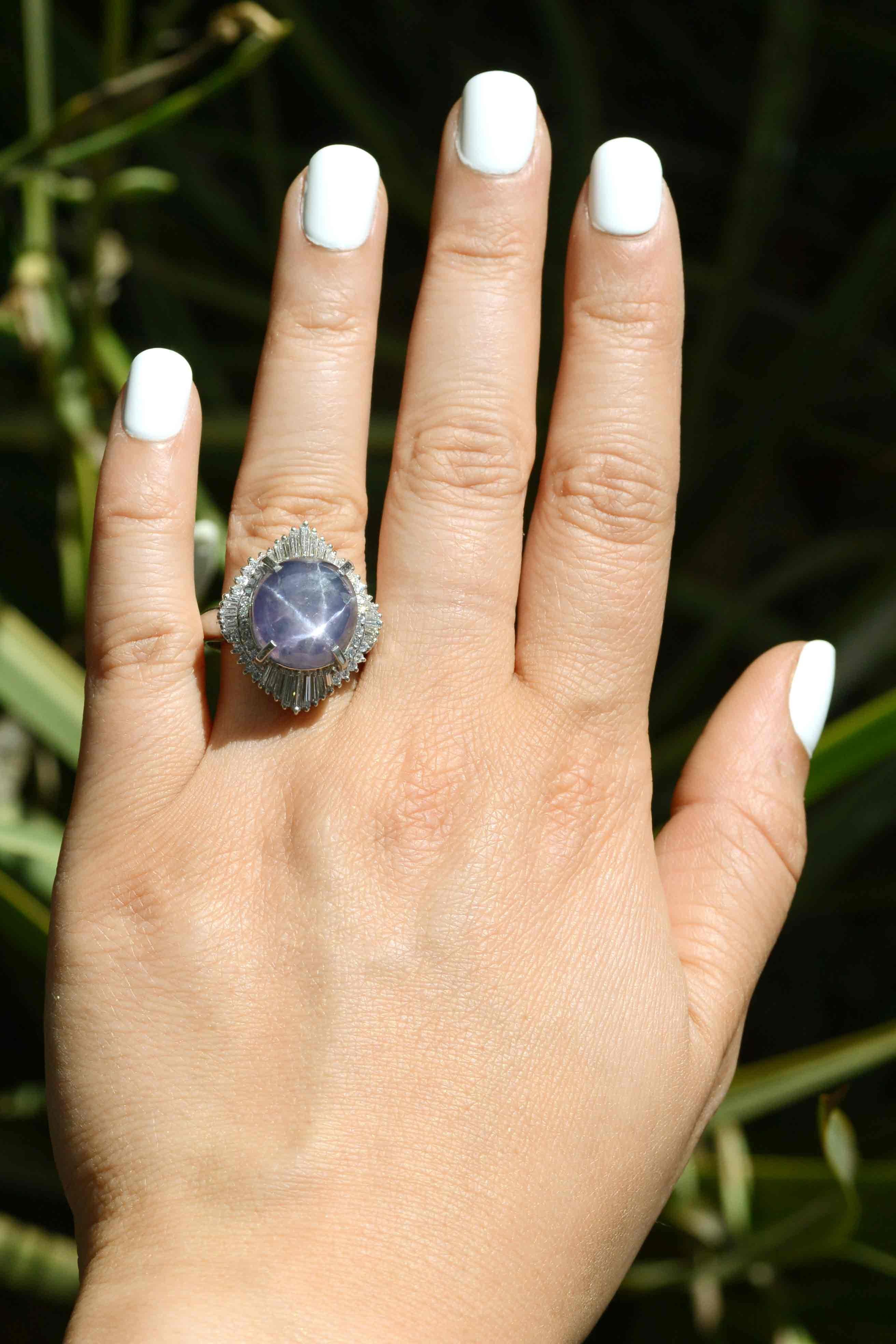 The Jacksonville star sapphire and diamond ballerina ring. Talk about a showstopper! This fabulous dome cocktail ring showcases an absolute stunner of a gemstone; a nearly 20 carat natural purple sapphire with a distinct and pronounced six pointed