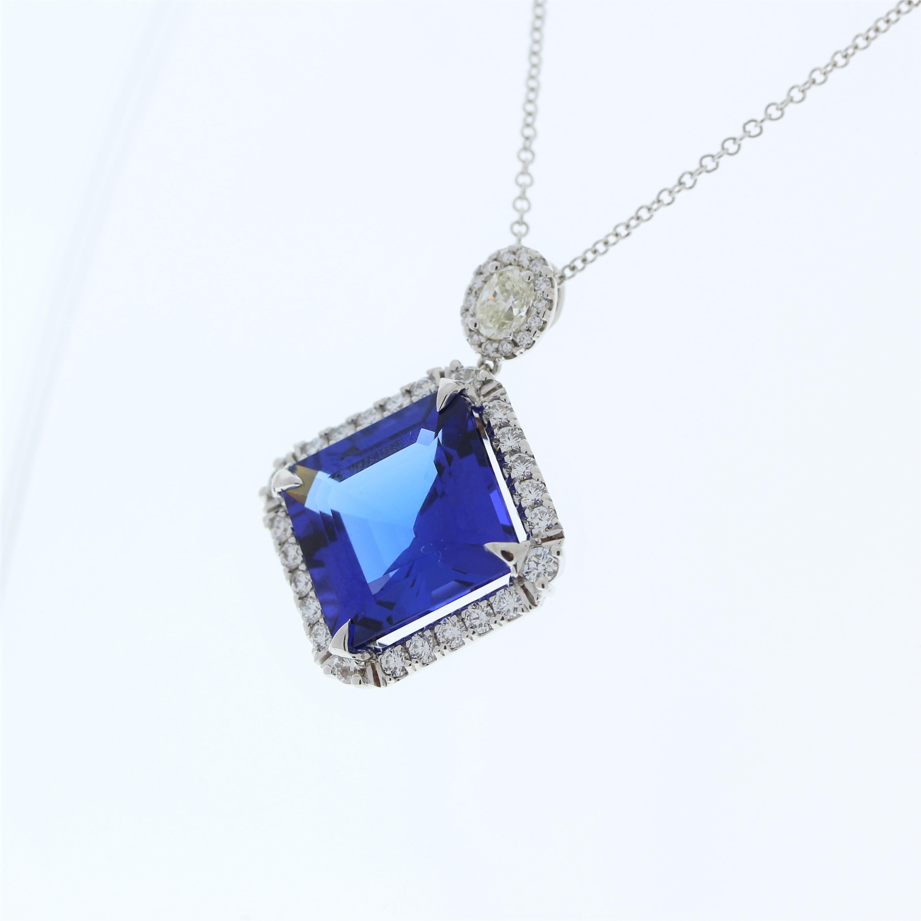 A fashion pendant featuring an 18k white gold setting with a main stone of a square emerald-cut bluish violet tanzanite weighing 21.00 carats and a single oval-cut diamond weighing 0.52 carats as a side stone would be a truly remarkable and stunning