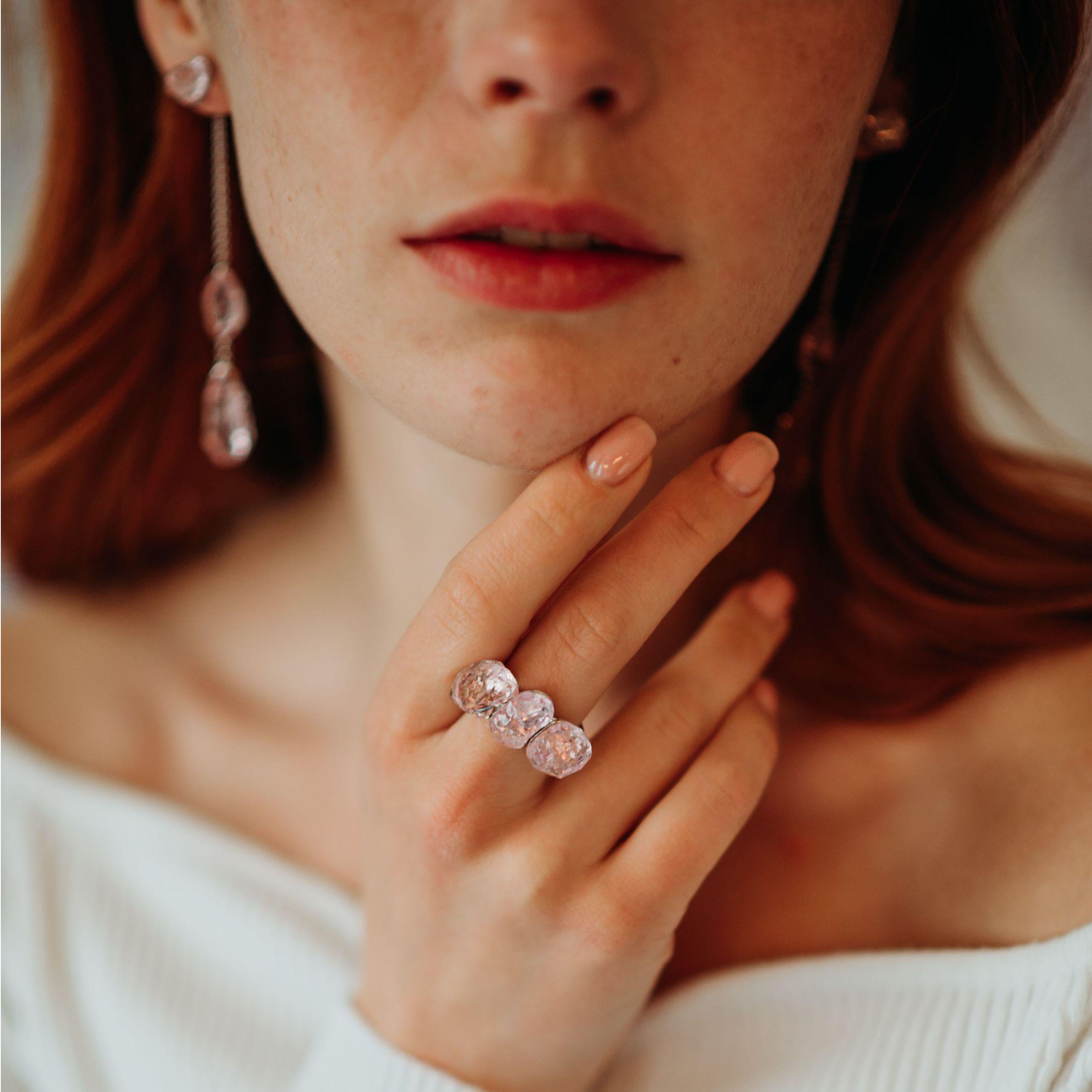 For this organic looking platinum ring, I took three deep pink, little over 21 carats rough morganites, polished them a little and carved notches around them, to make inlay settings. The goal was to arrange the gems in an incidental looking way and
