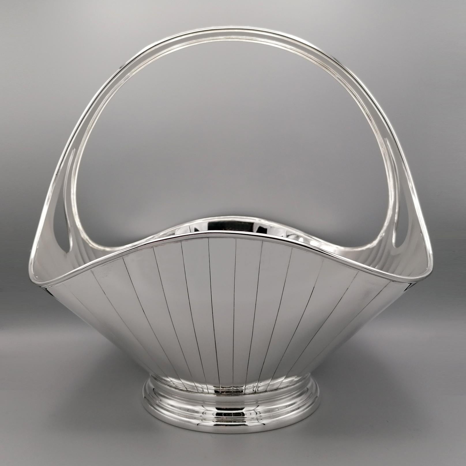 Gorgeous completely handmade sterling silver basket. 
Made from a unique sterling silver sheet, except the base, the basket has been hand molded and turned to give it an elegant and harmonious shape. 
The base is round and shaped with a double step.