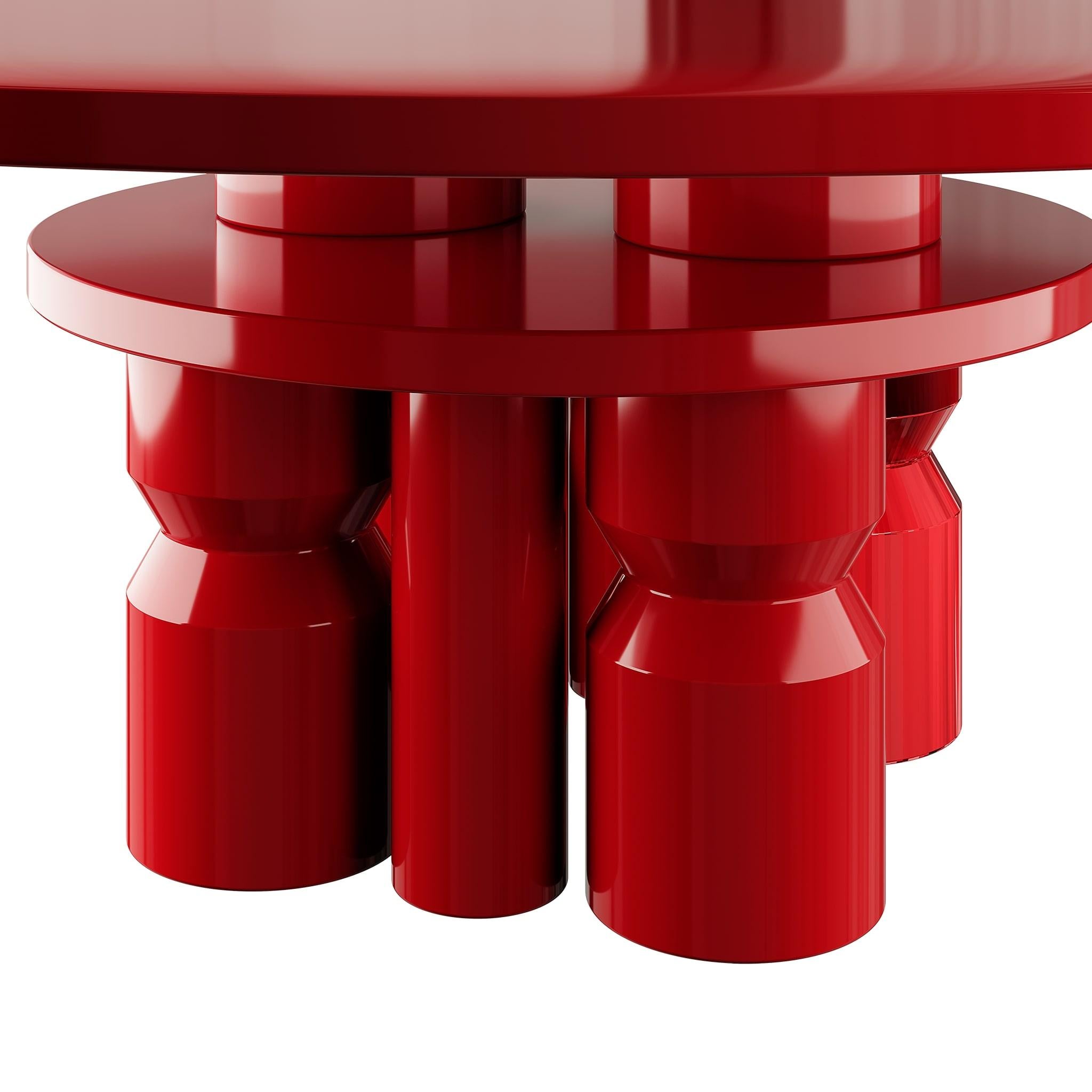 La table à manger Volver est une table ronde moderne unique, parfaitement conçue pour une salle à manger contemporaine. Sa finition laquée rouge vibrante en fait une pièce d'apparat, insufflant énergie et personnalité à votre projet de décoration
