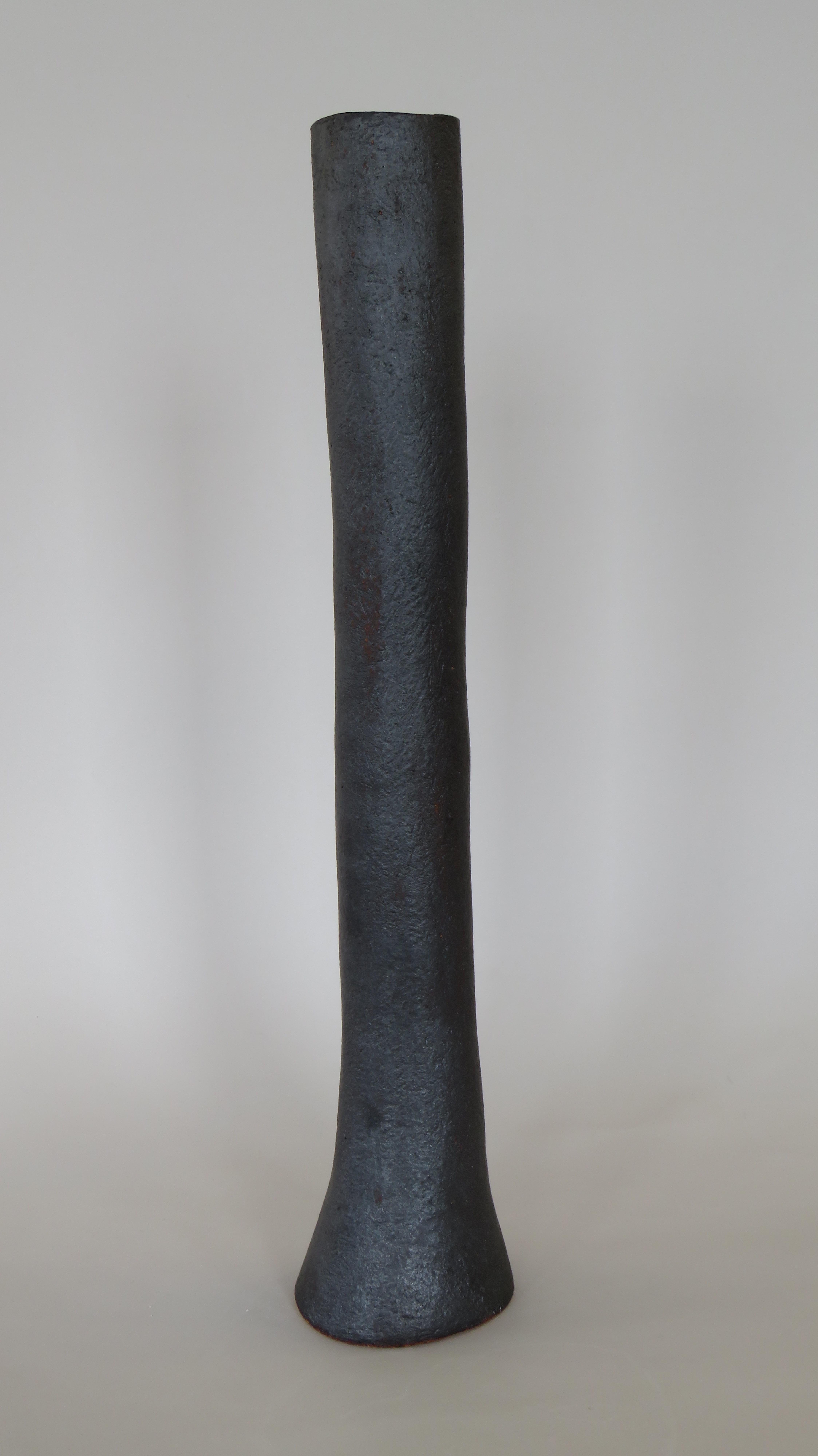 tall black ceramic vase
