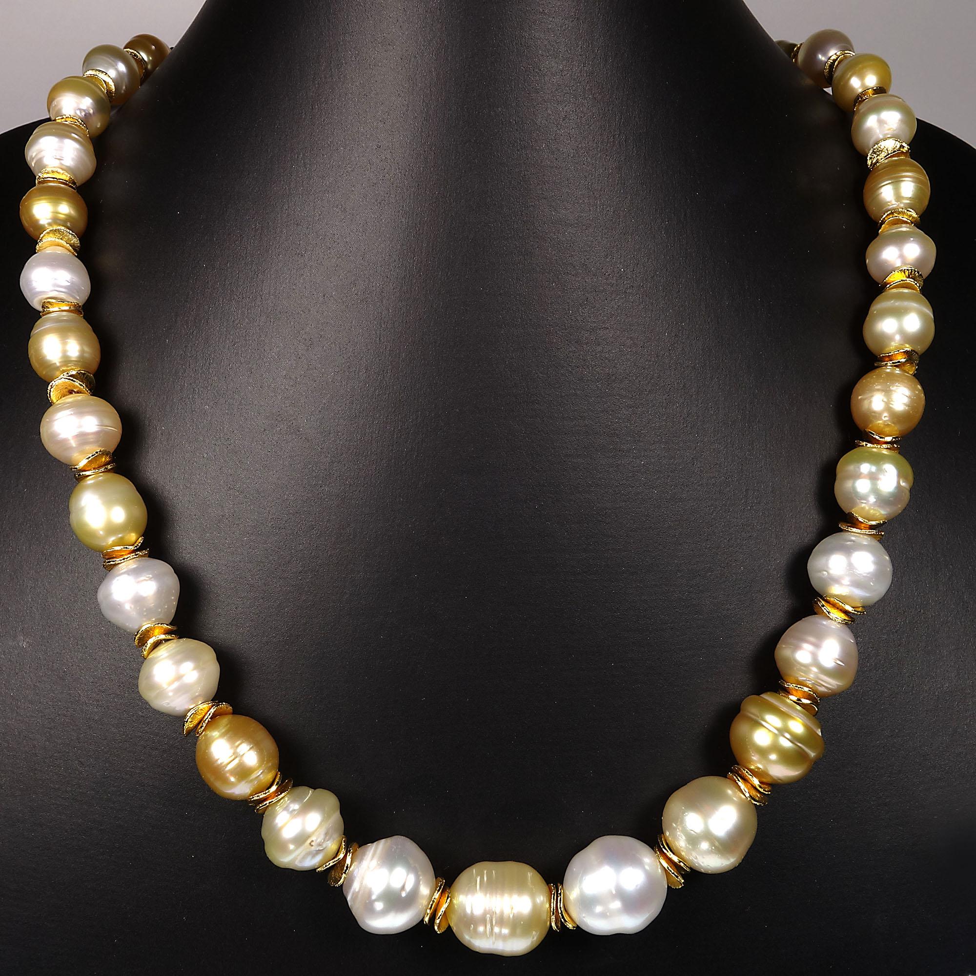 Elegant Baroque Pearl necklace of gold and white tones accented with gold tone flutters.  This unique 21 inch necklace is secured with a 14K gold plate over Sterling Silver hook and eye. Pearl is the June birthstone.  See more from this designer by