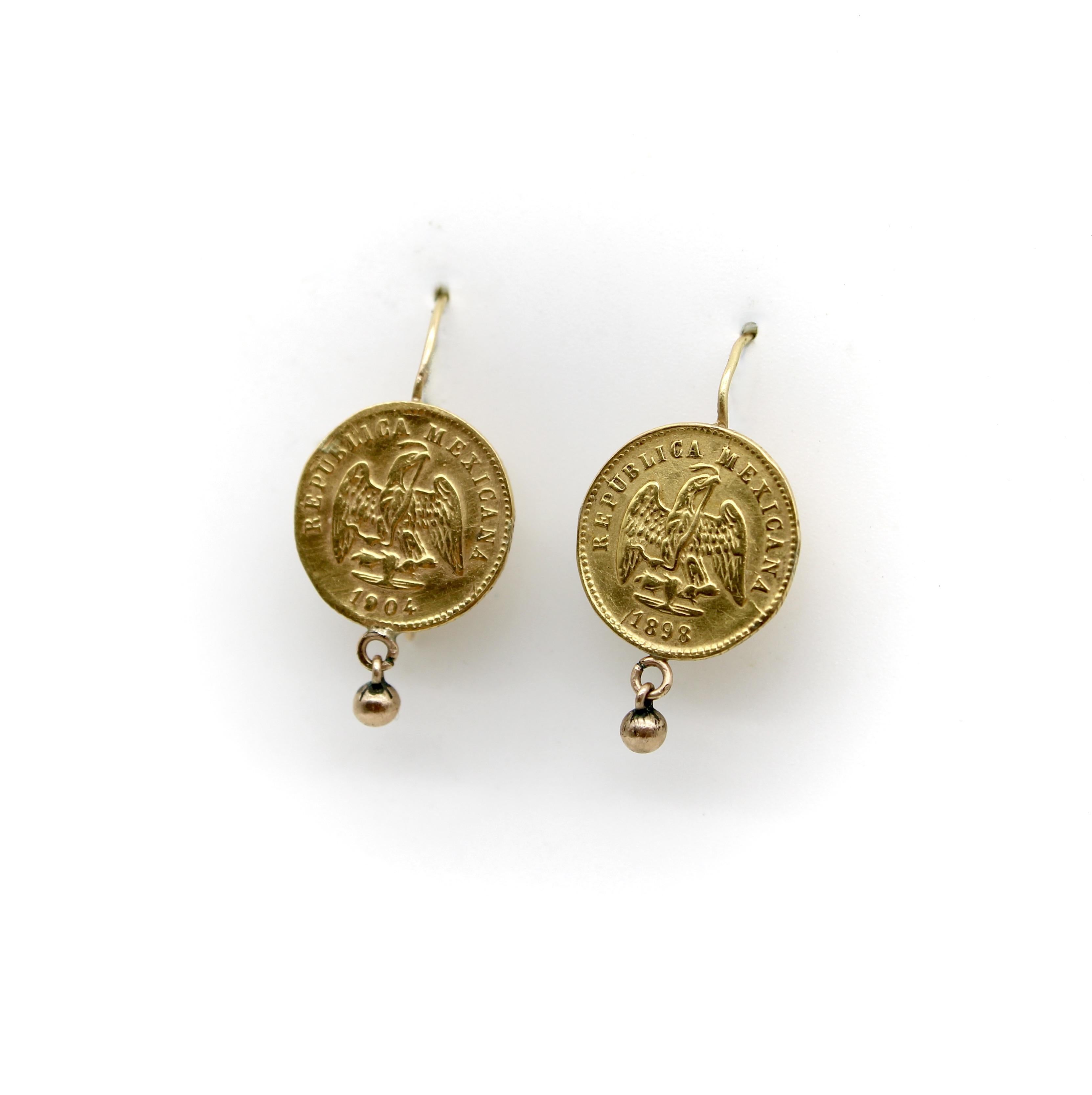 These 21k gold earrings are Mexican pesos that were minted in the years 1898 and 1904. They bear the image of the Mexican eagle eating a snake, with the words “Republica Mexicana.” The Mexican eagle holds a snake in its mouth as part of the legend