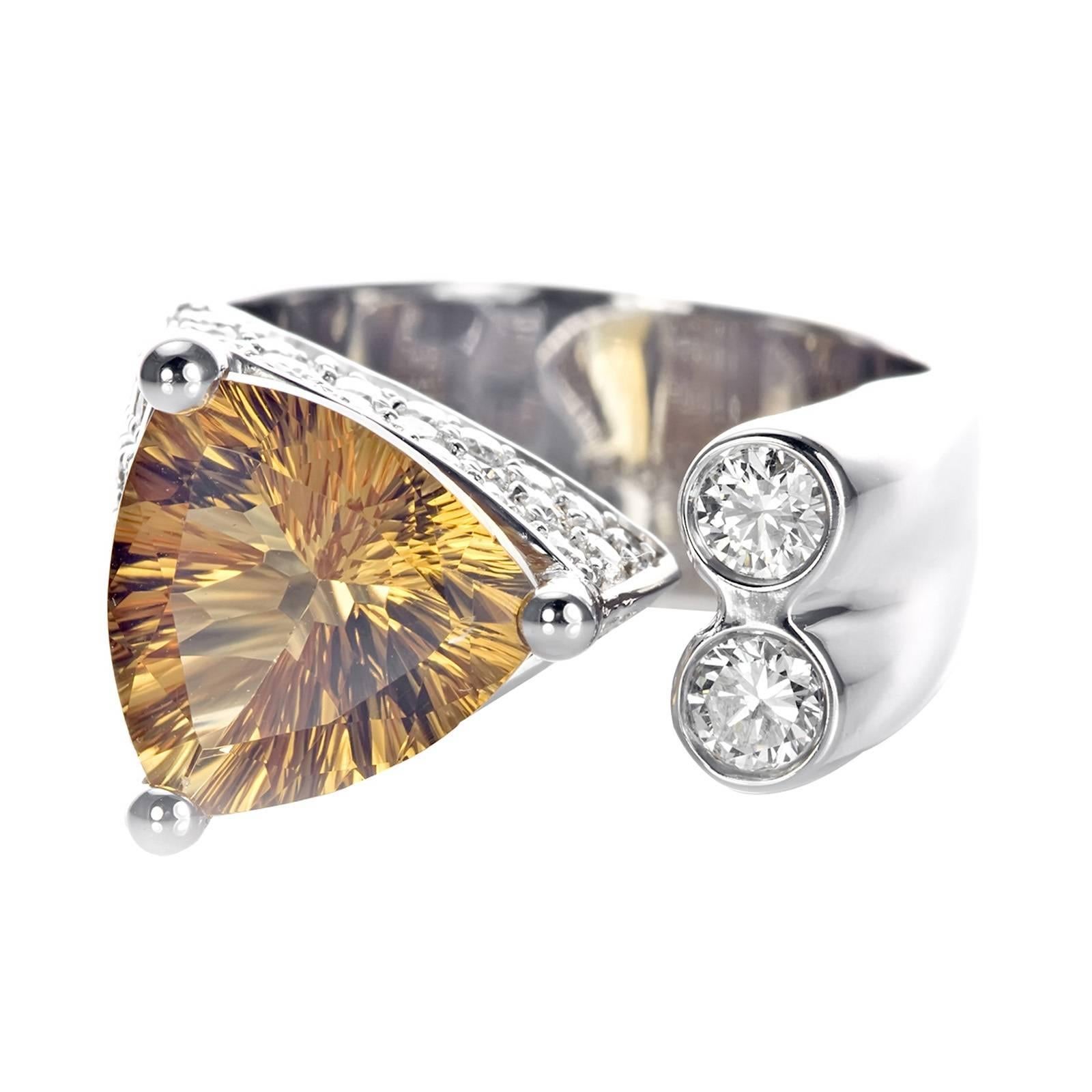 Expertly crafted in 19 grams exclusive solid 21K White Gold
Constructed through micro setting with white diamonds
Set around a trillion citrine gemstone
Micro setting done by master setters
Includes a customized IGI Appraisal
Manufacturing