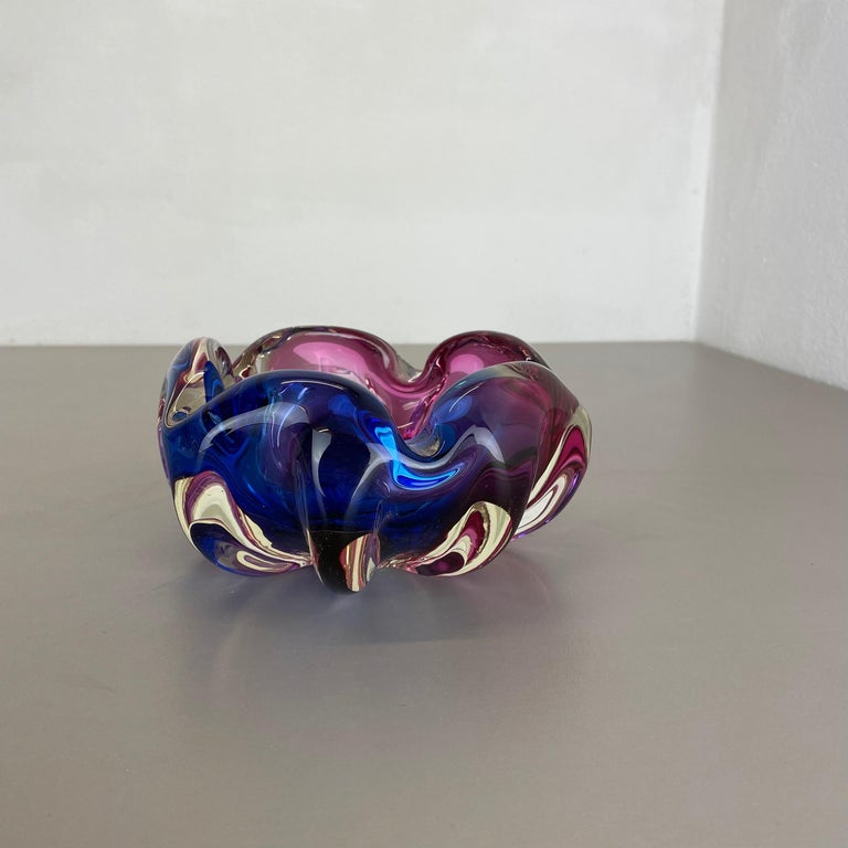Article:

Murano glass bowl, ashtray element


Origin:

Murano, Italy


Decade:

1970s


This original glass shell bowl was produced in the 1970s in Murano, Italy. An elegant purple pink Murano glass element with a nice floral abstract structure.