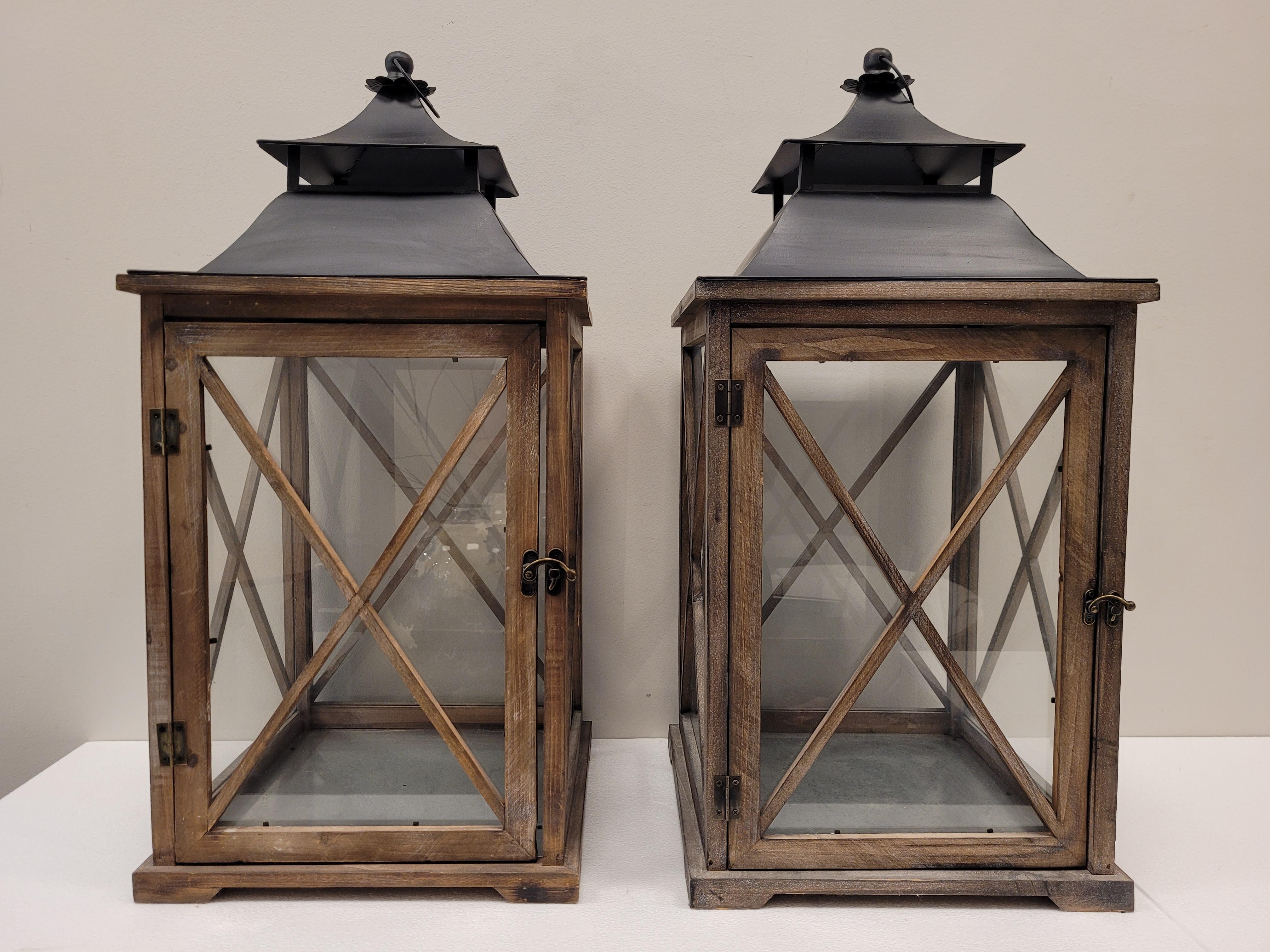 Amazing pair of photophores or lanterns for candles, France, 20th century,
In the form of small French houses with tin roofs and framed windows.
In washed oak and wrought iron on the ceiling. A side door opens, on the top it is separated on the