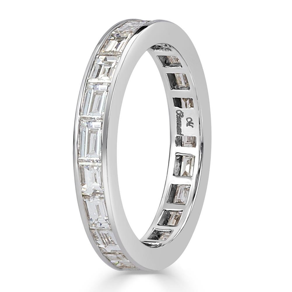 Handcrafted in 18k white gold, this elegant diamond eternity band features 2.10ct of baguette cut diamonds graded at E-F, VS1-VS2. All eternity bands are shown in a size 6.5. We custom craft each eternity band and will create the same design for you
