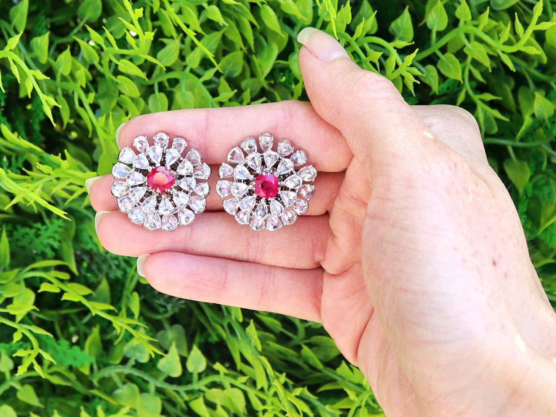 A stunning, fine and impressive rare pair of 2.10 carat Burmese ruby and 14.12 carat diamond, 18 karat white gold day and night earrings; part of our antique ruby jewelry collection.

These stunning, fine and impressive day and night earrings are