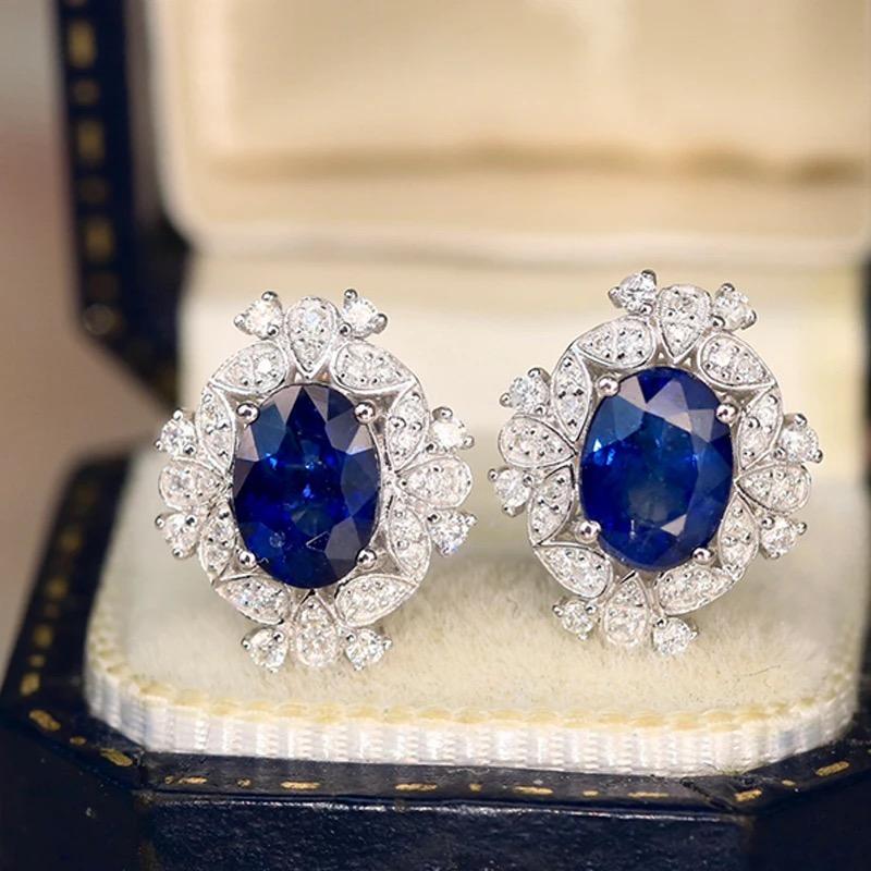 Beautiful with a solid 18k White gold earring with 2.10 ct Natural Royal Blue sapphire 

Metal: 18k White Gold

Central Stone Material: Natural Blue Sapphire

Side Stone Material: Natural Diamond

Diamond Clarity: SI

Diamond Color Grade: IJ

Total