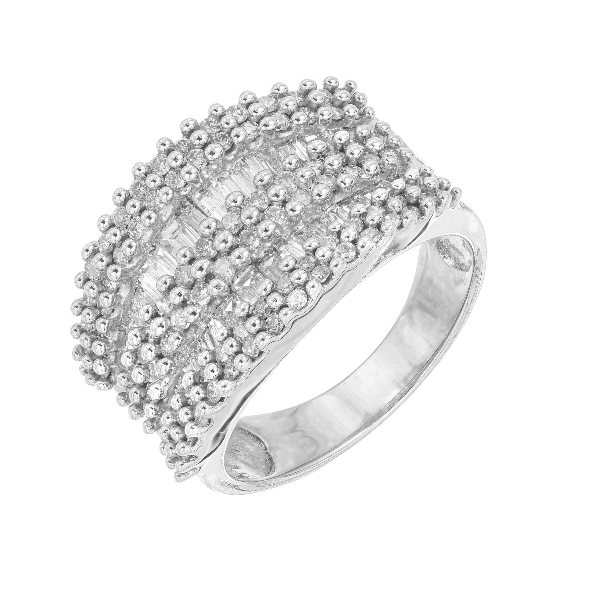 Diamond cluster band ring. 9 rows of round and baguette diamonds set in 14k white gold. 

98 round diamonds, approx. total weight 1.40cts, J-K, SI
36 baguette diamonds, approx. total weight .70cts, J-K, SI
Size 8 and sizable
14k White Gold
Stamped: