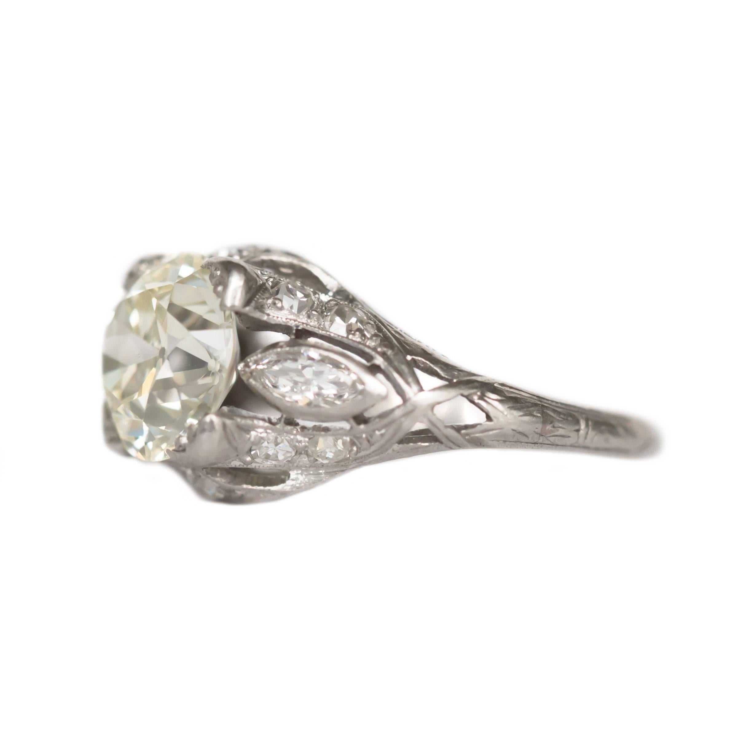 Item Details: 
Ring Size: 5
Metal Type: Platinum
Weight: 4.3 grams

Center Diamond Details:
Shape: Old European Brilliant
Carat Weight: 2.10 carat
Color: M
Clarity: VS2

Side Stone Details: 
Shape: Antique Marquise and Antique Single Cut
Total Carat