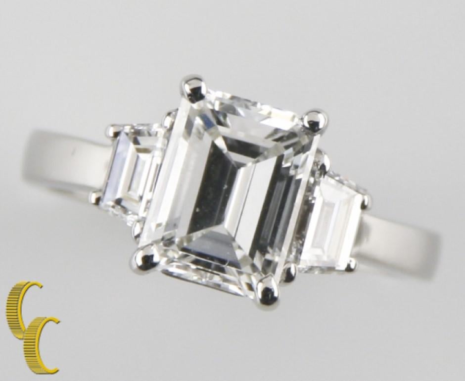 Gorgeous Three Stone Engagement Ring in Platinum
Features Three Emerald Cut Stones
Side Stones are Approximately .20 carats each (.40 Total), VS Clarity, F Color
Total Carat Weight: 2.10 carats
Ring Size 5.25
Total Mass = 5.4 grams
Center Stone