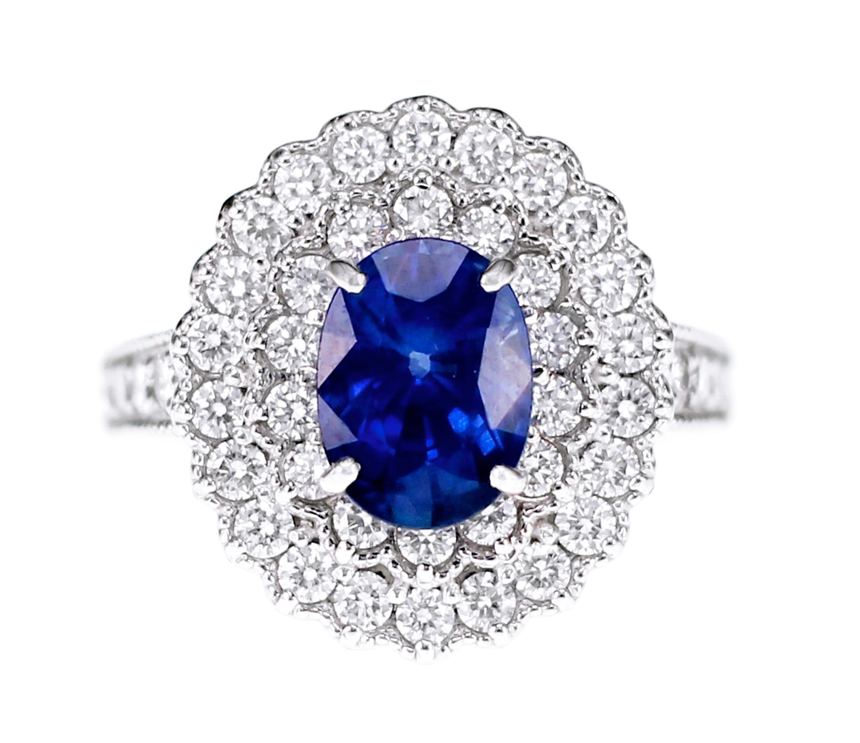 Japanese certified 2.10 carat of blue sapphire is set with a carat of white round brilliant diamond. the classical design makes it an easy choice for all occasions. 