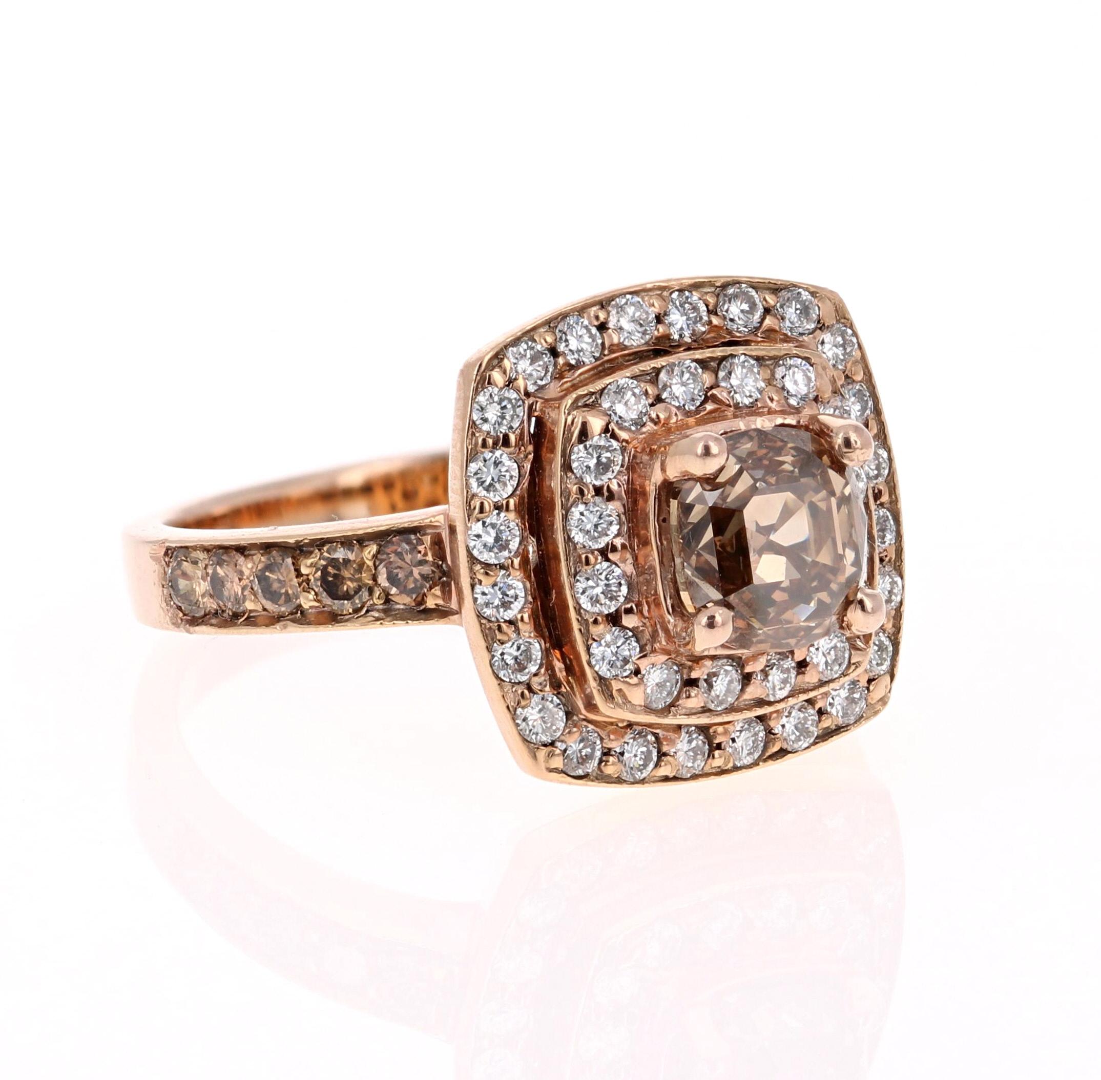 This beauty has a deep Brown/Champagne colored natural Round Cushion Cut Diamond that weighs 1.31 Carats. It is surrounded by a double halo of 40 Round Cut Diamonds that weigh 0.48 Carats. The sides of the ring have 10 Brown/Champagne Diamonds that