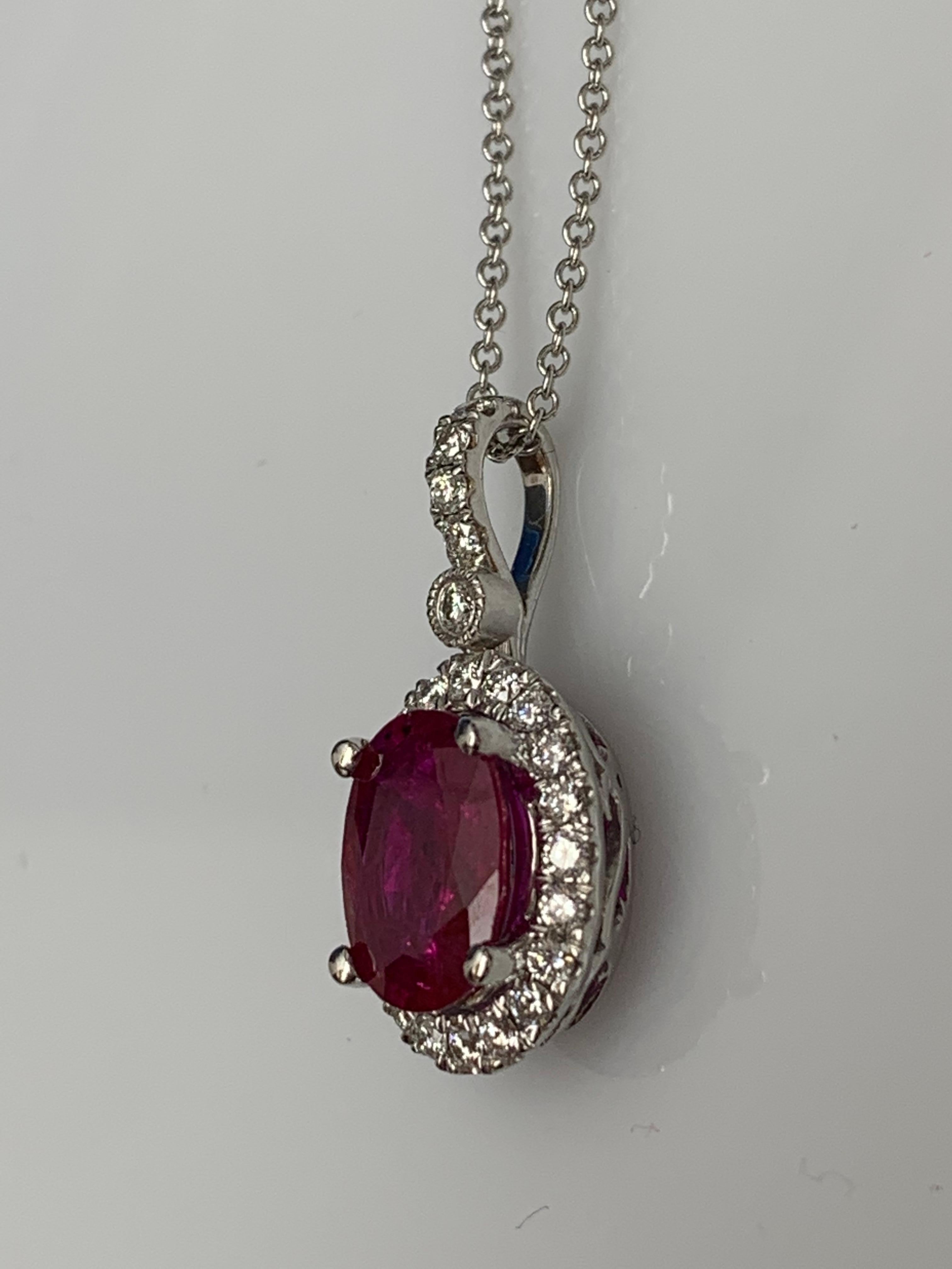 Modern 2.10 Carat Oval Cut Ruby and Diamond Halo Pendant Necklace in 18K White Gold For Sale
