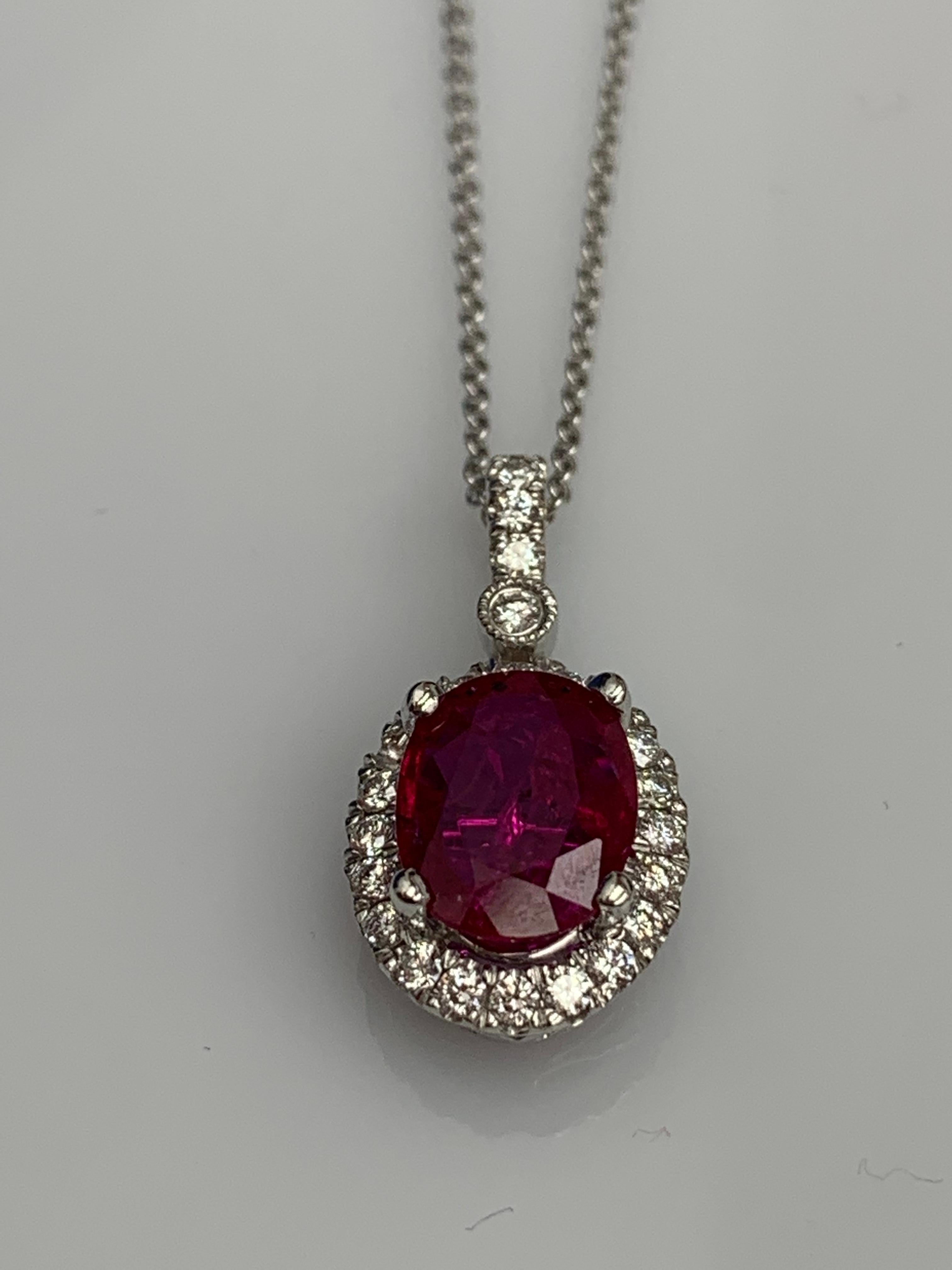 2.10 Carat Oval Cut Ruby and Diamond Halo Pendant Necklace in 18K White Gold In New Condition For Sale In NEW YORK, NY