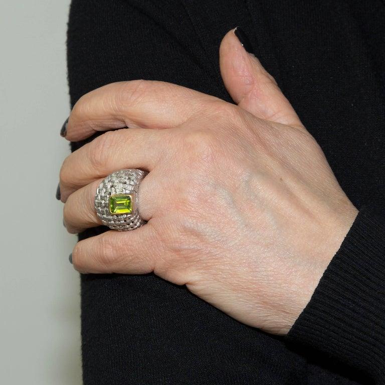 Beautifully hand crafted Basket Weave Sterling Silver Ring. SEcurely hand top set with a 2.10 Carat Peridot. Top of ring measures approx. 20mm wide; tapered shank; Ring size: 7.5, we offer ring resizing. Bold yet unmistakably Feminine! A perfect
