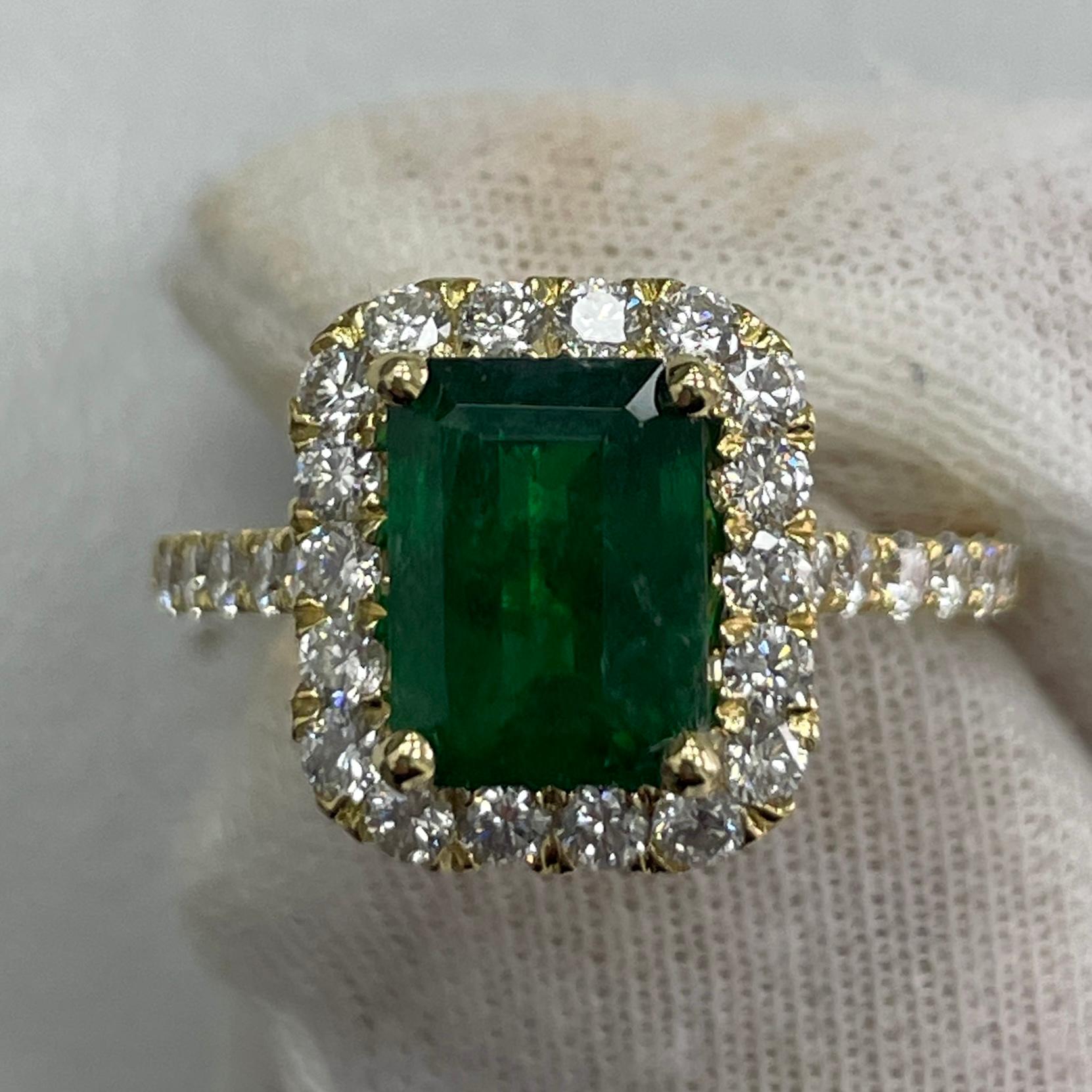 This is a BREATHTAKING emerald mined in Zambia. It is fully saturated. This emerald has a beautiful ever green color and mounted in a detailed and 18K yellow gold ring with 0.99carats of brilliant white diamonds.