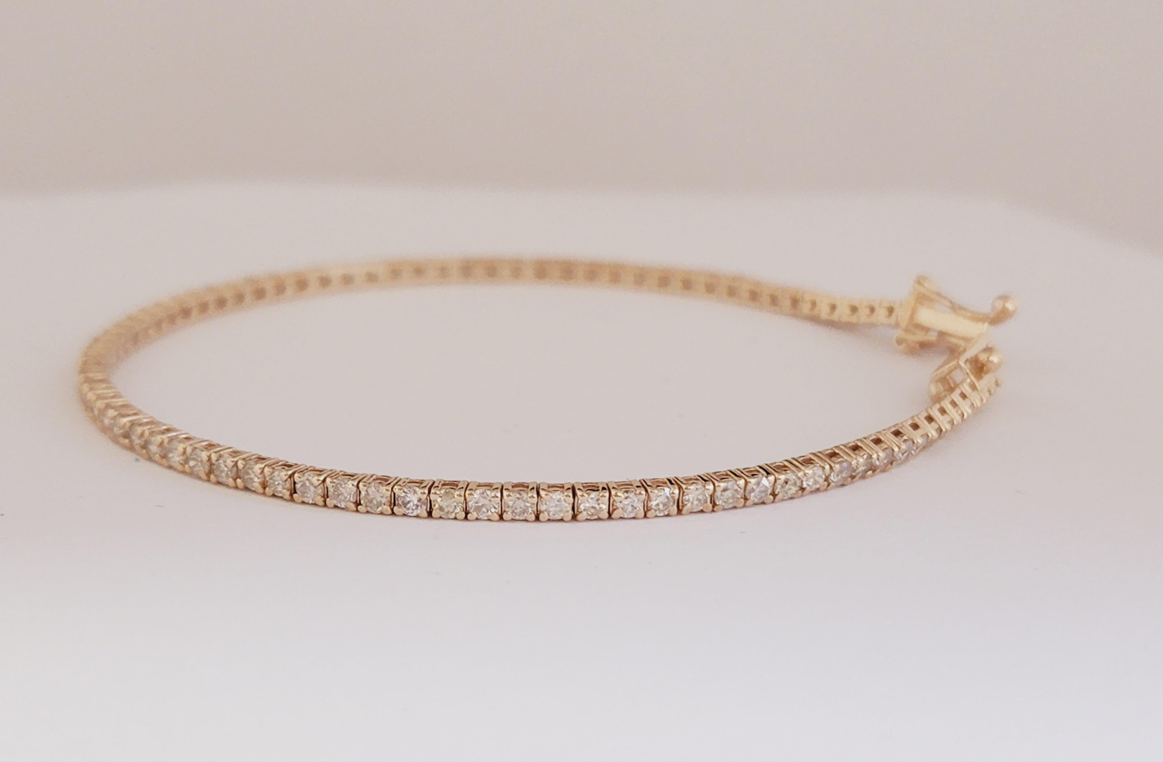 Beautiful natural diamond tennis bracelet, round-brilliant cut white diamonds clean and Excellent shine. 14k rose gold classic four-prong style for maximum light brilliance. Ordinary style. Extraordinary elegance.

7 inch length. 
2 mm wide.