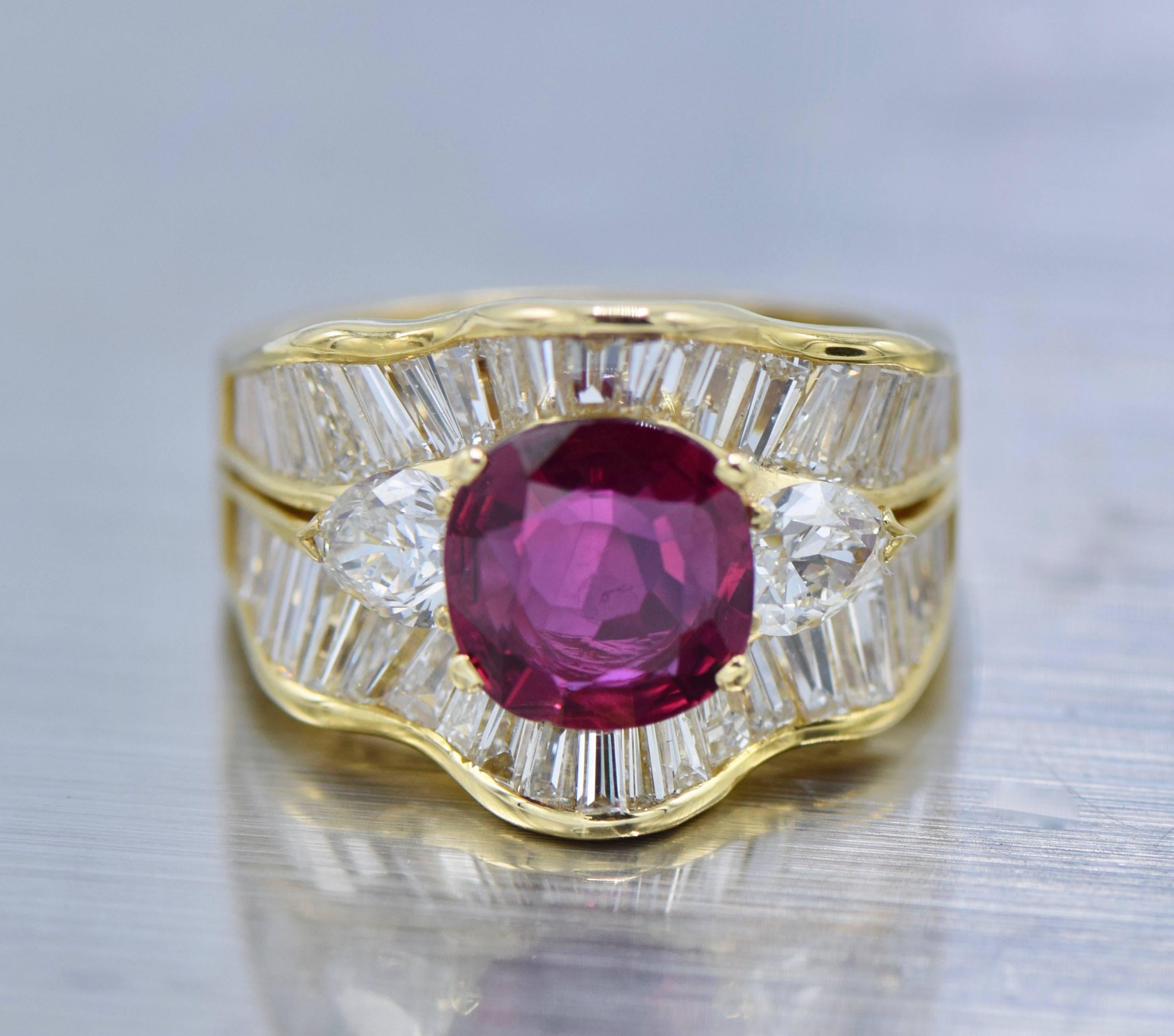 18 kt., one cushion-shaped ruby ap. 2.10 cts., 2 pear-shaped diamonds ap. .75 ct., 50 baguette & tapered baguette diamonds ap. 3.00 cts., ap. 7.5 dwts. 

With AGL report no. 1091096, Thailand origin, heat enhancement. 

Size: 7

Ruby: medium deep