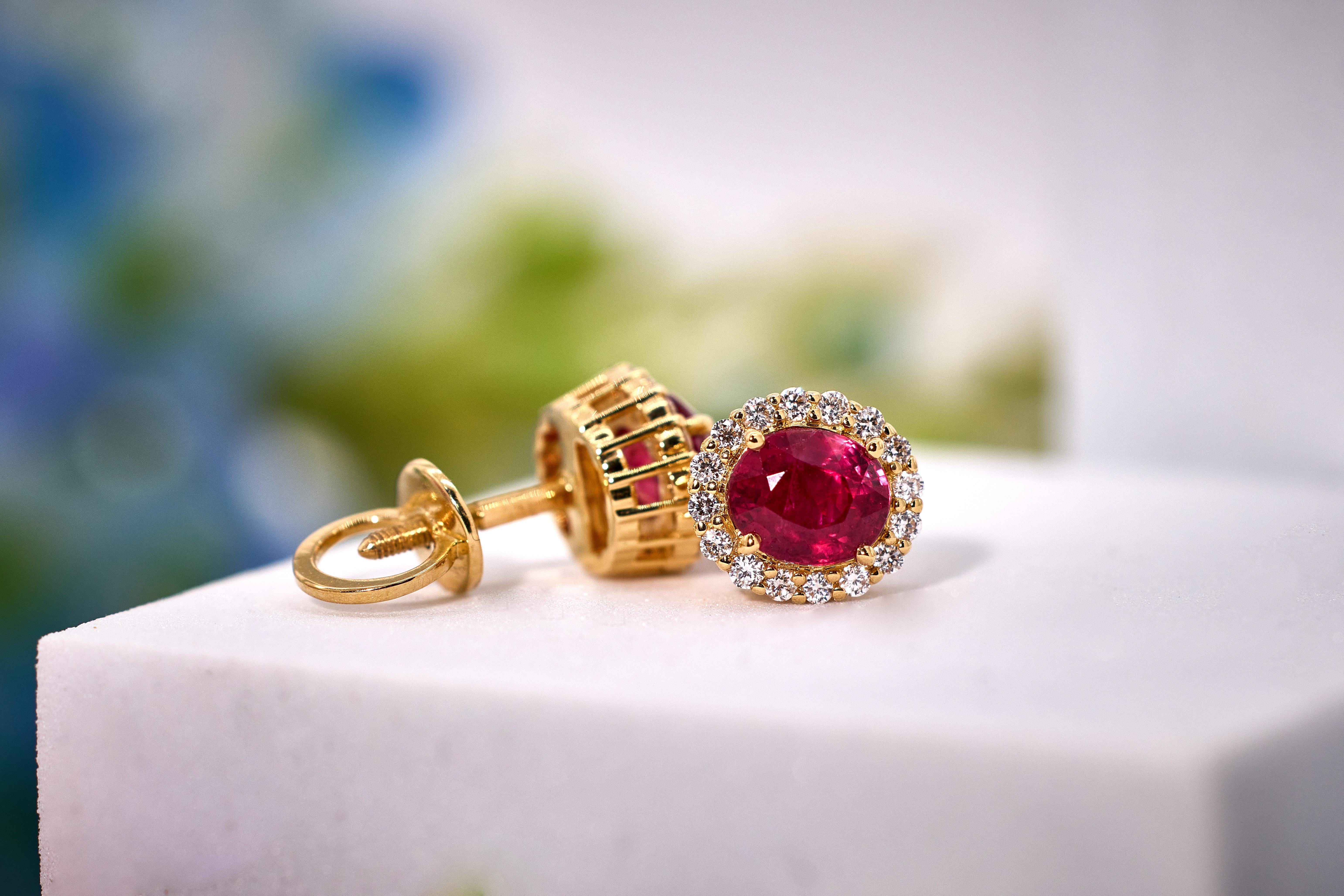 These earrings are made in house using fine Mozambique rubies. The total weight of rubies is 2.10 ct. Each Ruby is a little over 1.05 ct. Elegant and timeless designed earrings that are well made with attention to detail. Solid 18k gold Jewellery.