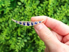 2.10 Carat Sapphire 0.25 Carat Diamond 9k Yellow Gold Crescent Brooch Circa 1890