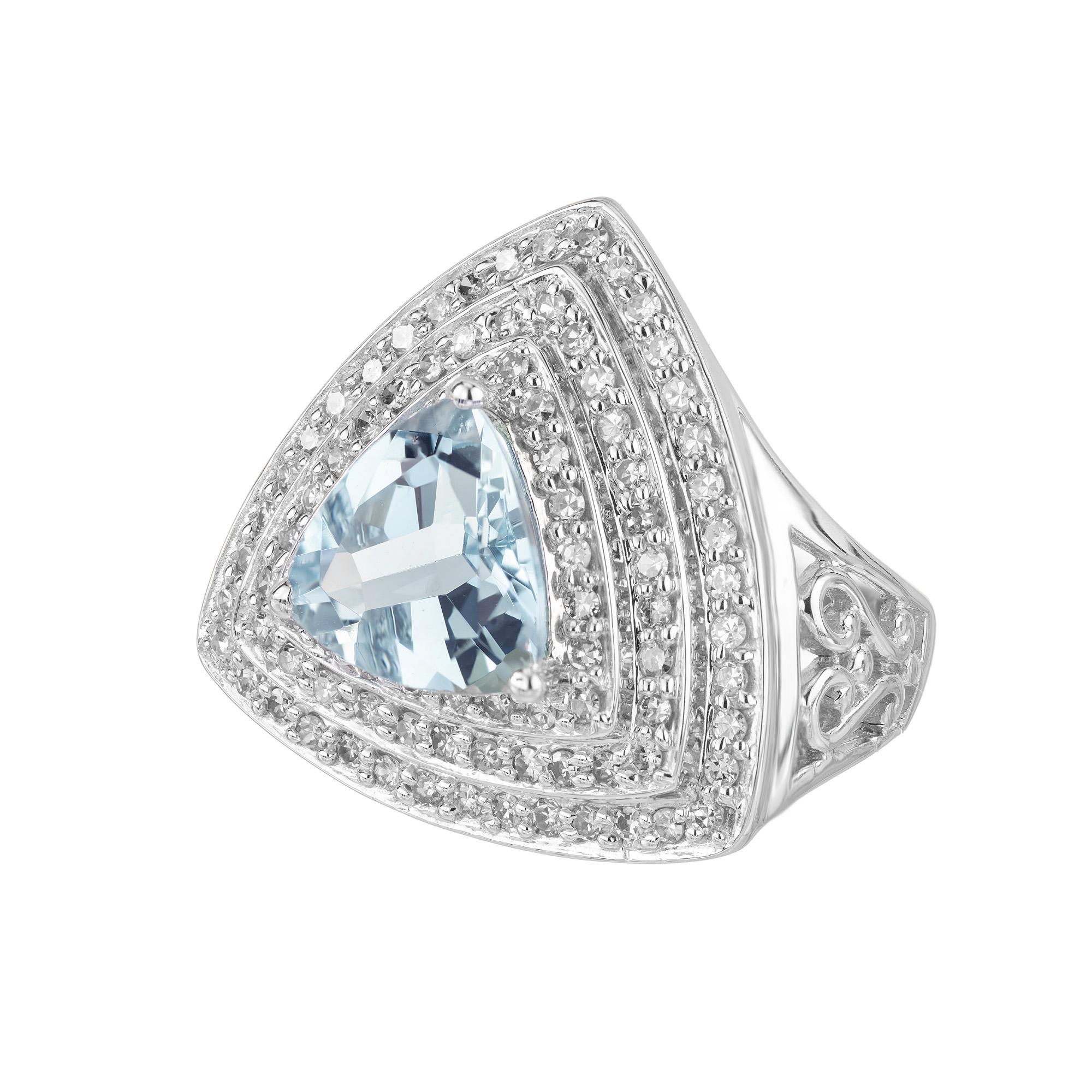 Unveiling a masterpiece of elegance, the 2.10ct triangle Aquamarine and Diamond halo white gold cocktail ring is a celebration of exquisite craftsmanship and mid century 1960's. The mesmerizing aquamarine center stone is cut into a distinctive