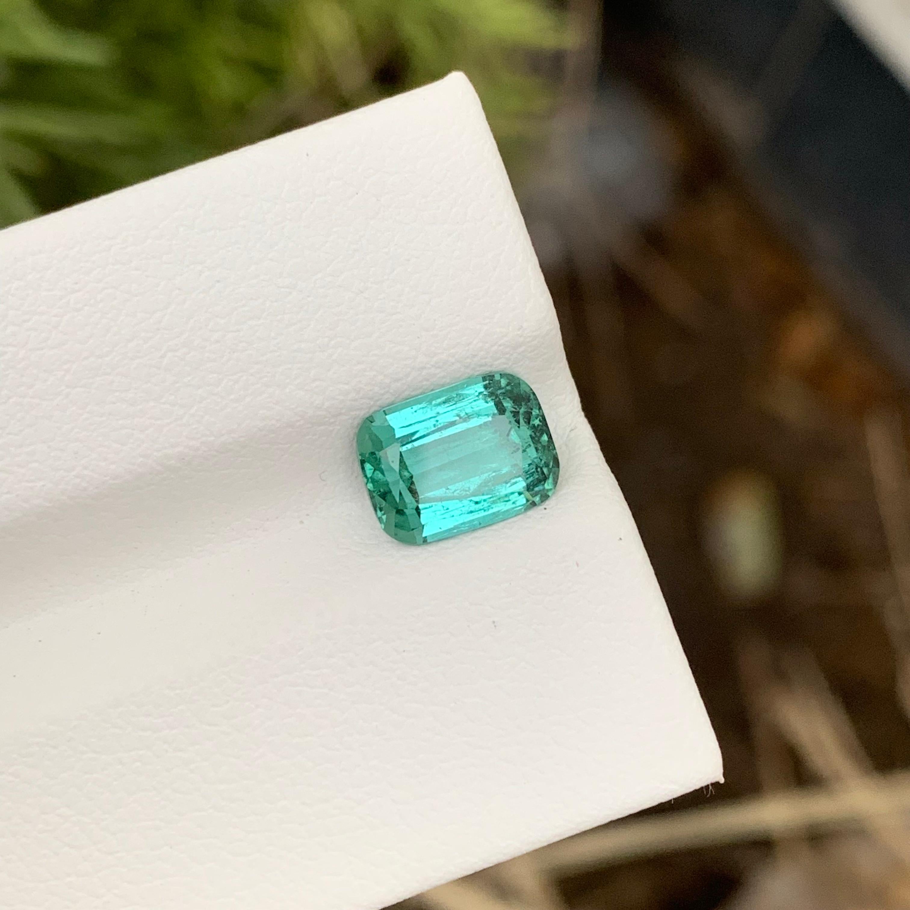 Loose Bluish Green Tourmaline 
Weight: 2.10 Carats
Dimension: 8.8 x 6.6 x 4.4 Mm 
Treatment: Non
Certificate: On Demand
Shape: Cushion 
Origin: Afghanistan 

Tourmaline, a gemstone of remarkable diversity, graces the world of jewelry with its