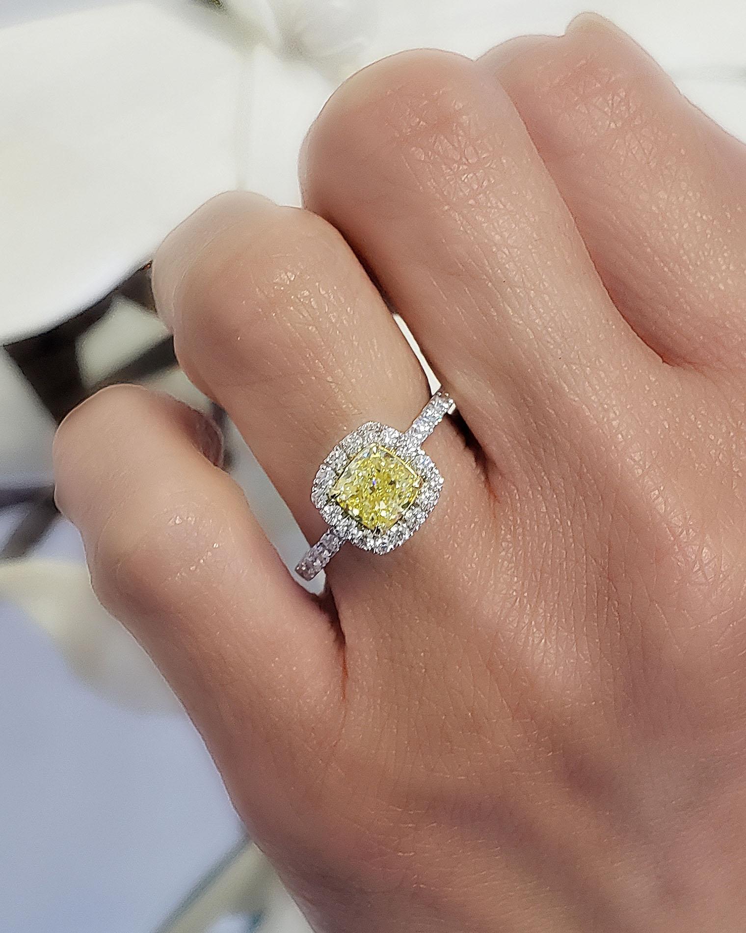 The simple elegance of this halo canary diamond engagement ring showcase the beauty of its centerpiece. 

Ring Information
Metal	: 14K Gold
Setting Type	: U-Pave
Total Carat : 2.10 Carats

Center Diamond
Type	: Natural Diamond
Shape	: Cushion