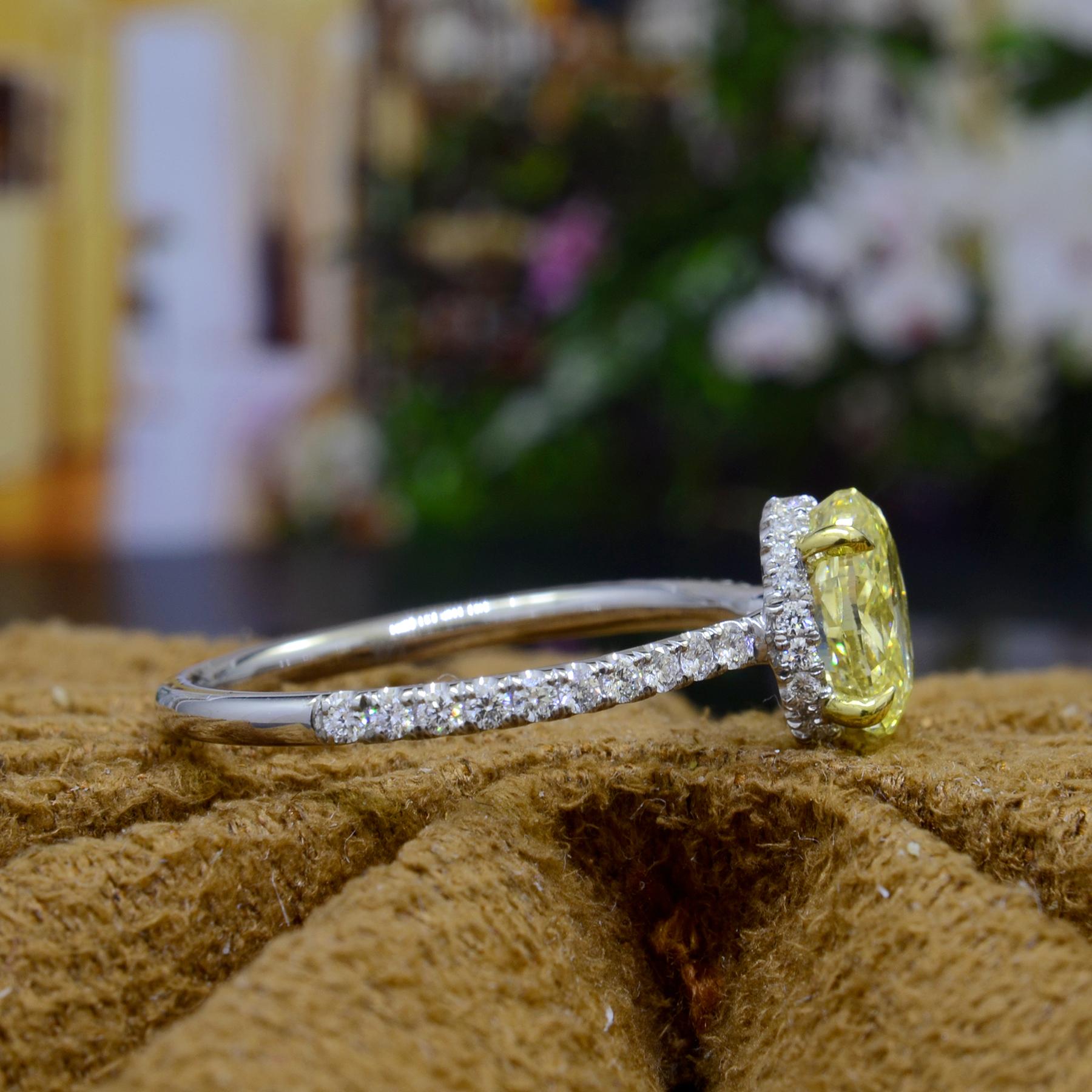 Modern 2.10 Carat Hidden Halo Canary Yellow Oval Engagement Ring VS2 Clarity GIA For Sale