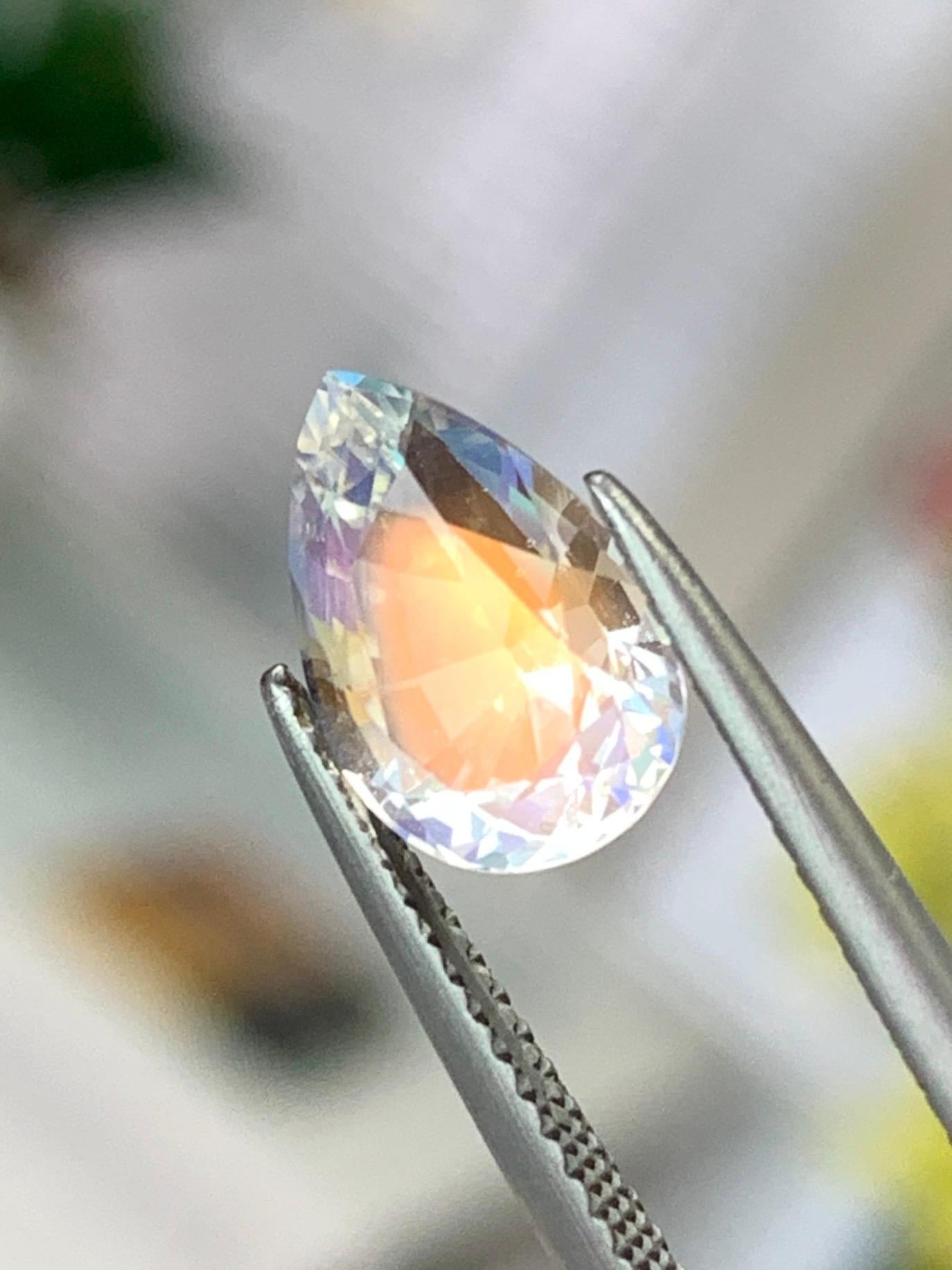 Natural feldspar moonstone, often known as rainbow moonstone, is a gemstone renowned for its captivating adularescence—a luminous sheen that appears to move across the surface as light interacts with its internal structure. This phenomenon creates a