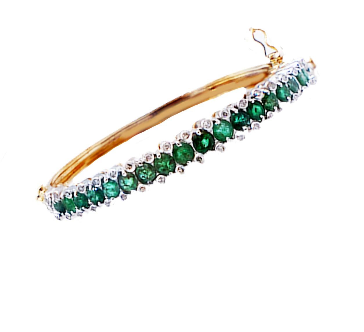 Vintage 1950's Emerald Diamond Bangle Bracelet, 14 Karat Yellow Gold with 18- round emerald stones accented with diamonds and set in platinum.
The under-cage gallery of the gemstones and the bangle are made of 14 karat yellow gold. Secure clasp with