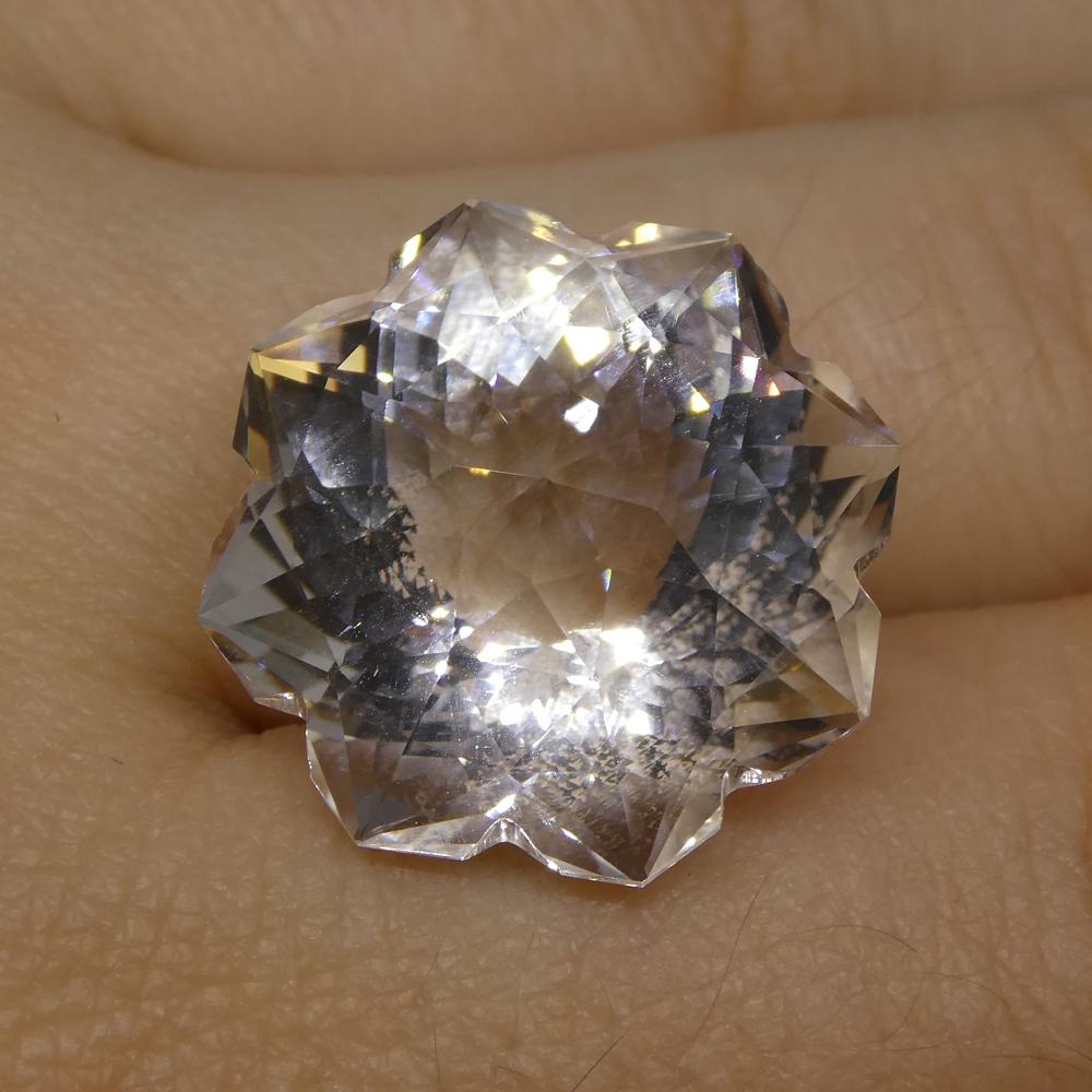 Description:

Gem Type: White Quartz
Number of Stones: 1
Weight: 21.01 cts
Measurements: 18x18x13.70 mm
Shape: Flower
Cutting Style: Fantasy Cut
Cutting Style Crown: Modified Brilliant
Cutting Style Pavilion: Mixed Cut
Transparency: