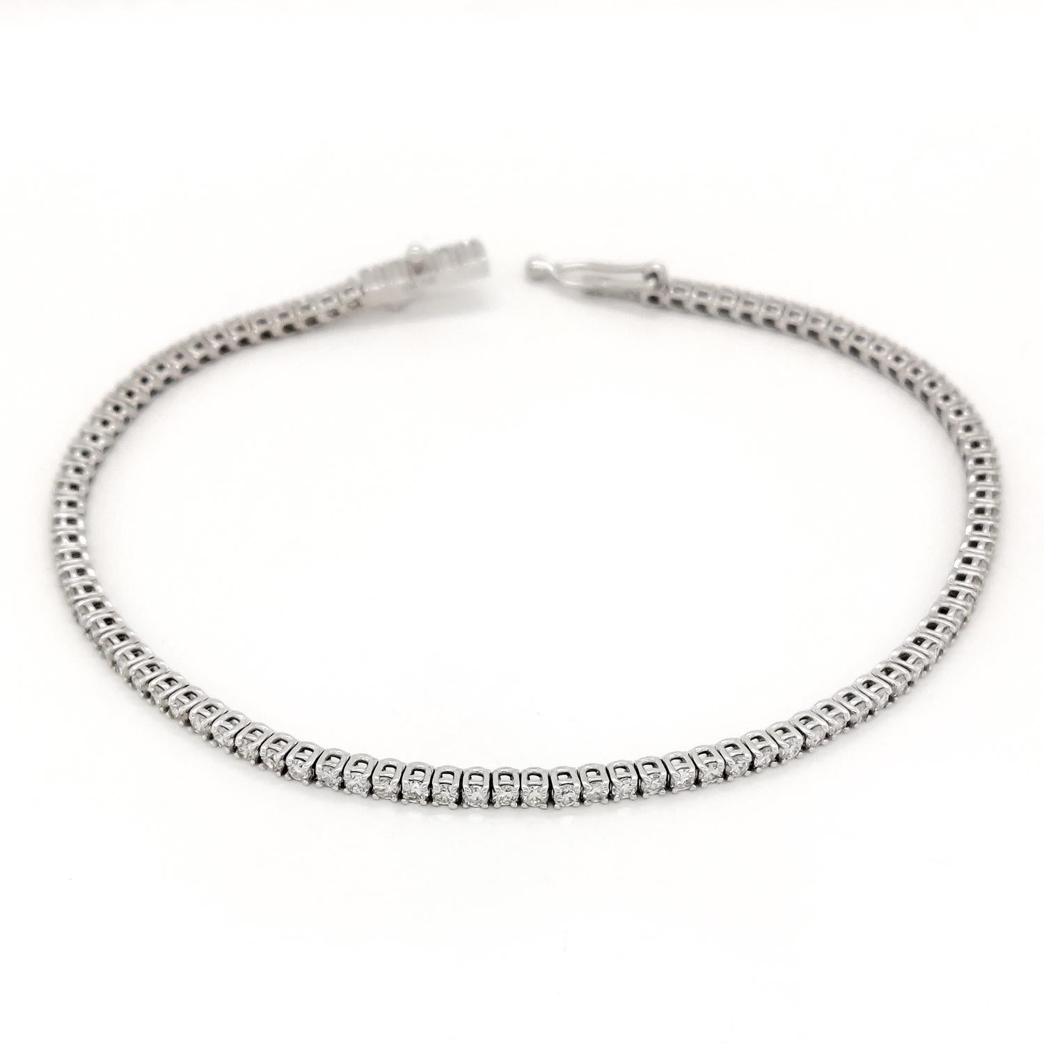 This classic and elegant 14kt white gold tennis bracelet showcases 94 endlessly sparkling diamonds, totaling 2.10 carat. This bracelet will give your favorite outfits unforgettable sparkle. 
For more information, please check the attached
