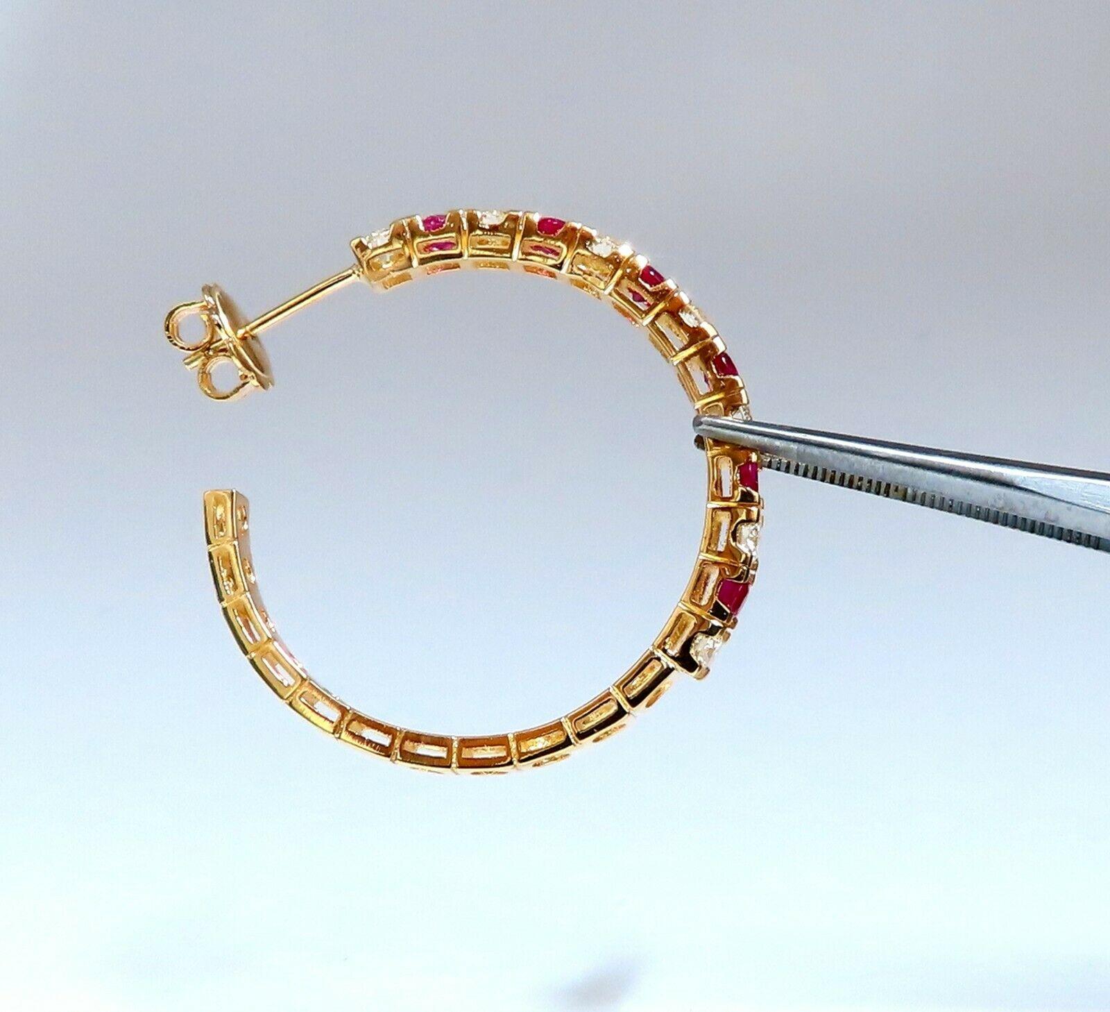 Rubies, Diamonds Alternated 

Inside Out 

.1.00ct. Natural Ruby Hoop Earrings.

Rubies: Rounds, Full Cut.

Transparent & Even Red tone.

Vivid red colors

1.10cts of round diamonds: 

G-color, Vs-2 clarity.

14kt. yellow gold

6.8 grams.

Earrings