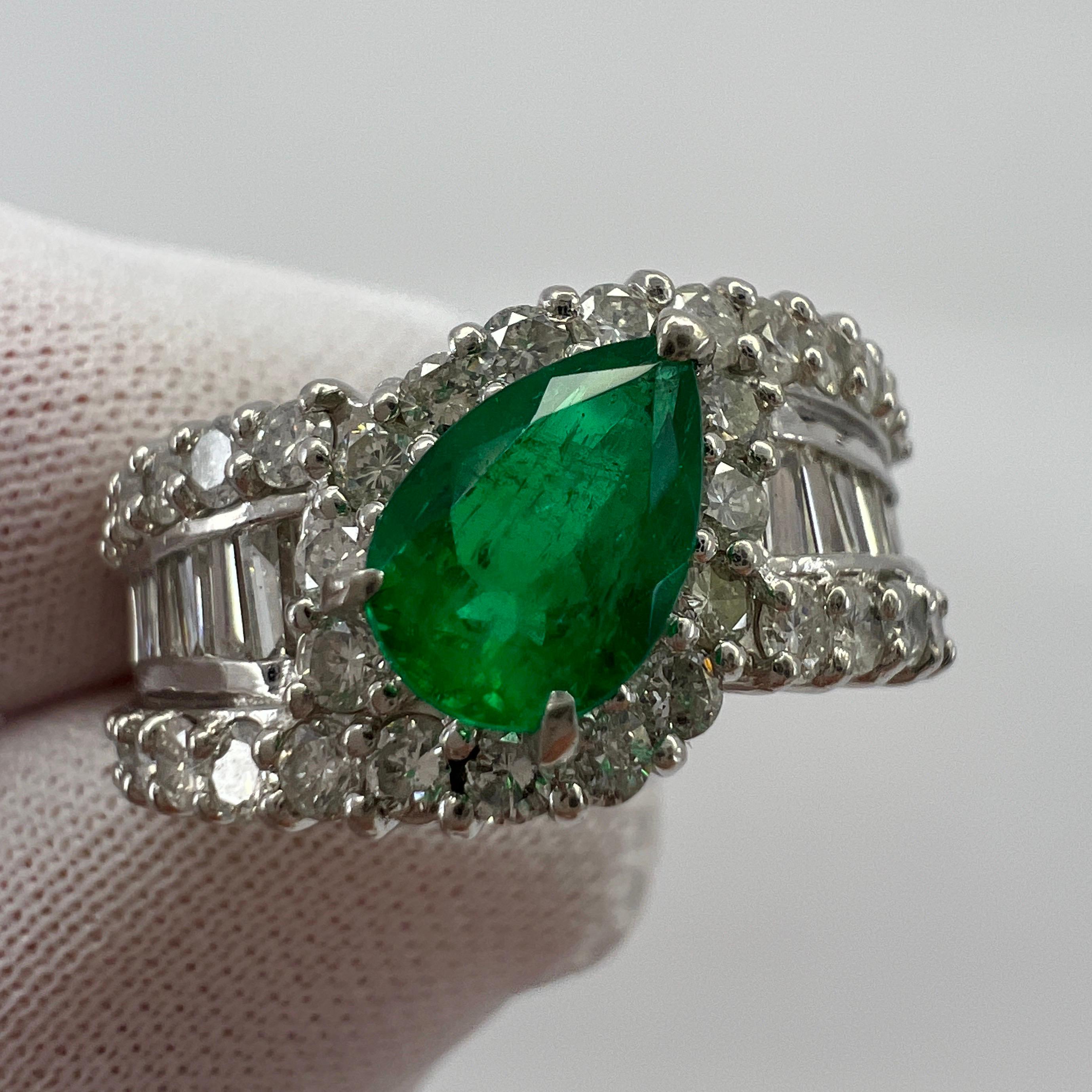 Fine Vivid Green Colombian Emerald & Diamond Platinum Cluster Ring.

Stunning 1.32 carat Colombian emerald with a fine vivid green colour and an excellent pear cut. The emerald has good clarity with only some small natural inclusions visible when