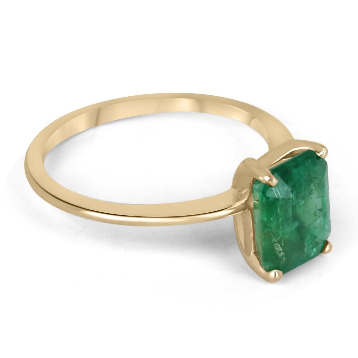 2.10cts 4 Prong Emerald Solitaire Ring 14K Gold - Natural Real 2ct Emerald Ring
Displayed is a custom emerald solitaire ring in 14K yellow gold. This classic ring carries a 2.10-carat emerald in a four-prong setting. The emerald has very good