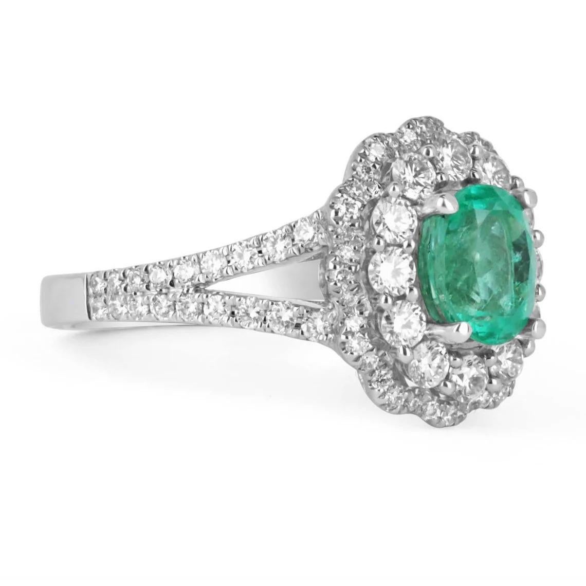 Displayed is a magnificent 2.10tcw natural Colombian emerald and diamond double halo cocktail gold ring. This is a perfect statement ring with a gorgeous center stone. The center gemstone is a fine quality Muzo emerald handset in a 14K white gold