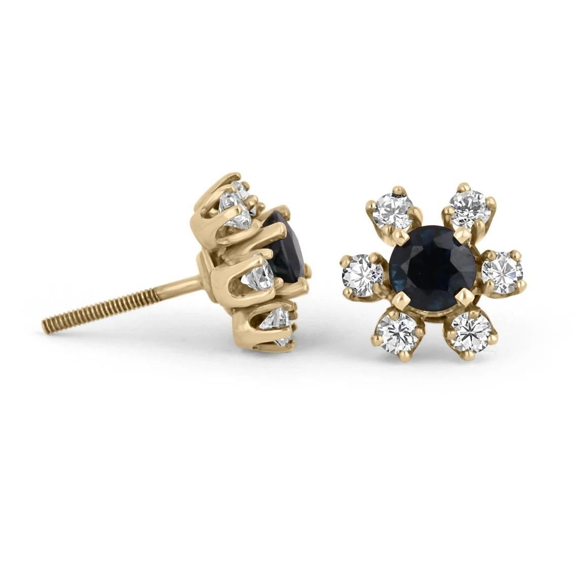 A stunning, vintage pair of natural sapphire and diamond stud earrings. The center stone holds 3/4's of fine quality, rich blue sapphires; surrounding the lovely gem are six brilliant round cut diamonds creating a halo effect resulting in a floral
